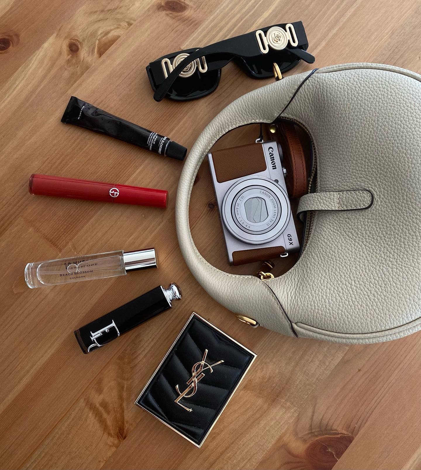What’s in my bag? 👛 
.
@grownalchemist lip balm
@armanibeauty maestro lipstick
@jomalonelondon beach blossom perfume
@diorbeauty Dior addict lipstick 
@yslbeauty mini clutch eyeshadow palette 
@canonusa G9x camera 📷 
.
.
What’s in my bag, luxury beauty, Pinterest girl aesthetic, filler pic, makeup aesthetic, moody aesthetic 
#giftedbyarmani #giftedbyjomalonelondon #giftedbyyslbeauty