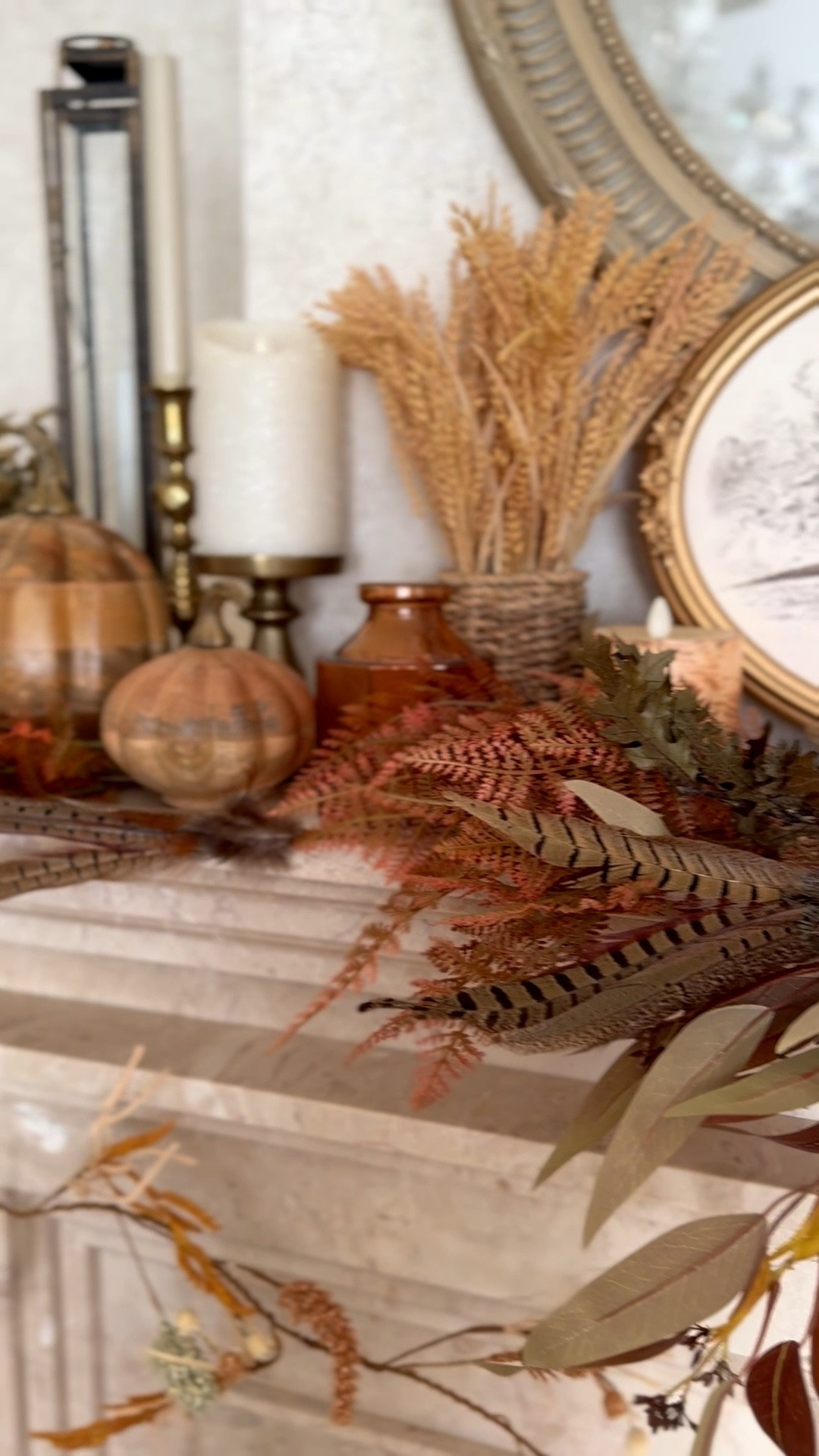 Fall living room mantel decor with wooden pumpkins, brown leaves, pheasant art, Luminara candles

#LTKHome #LTKSaleAlert #LTKSeasonal