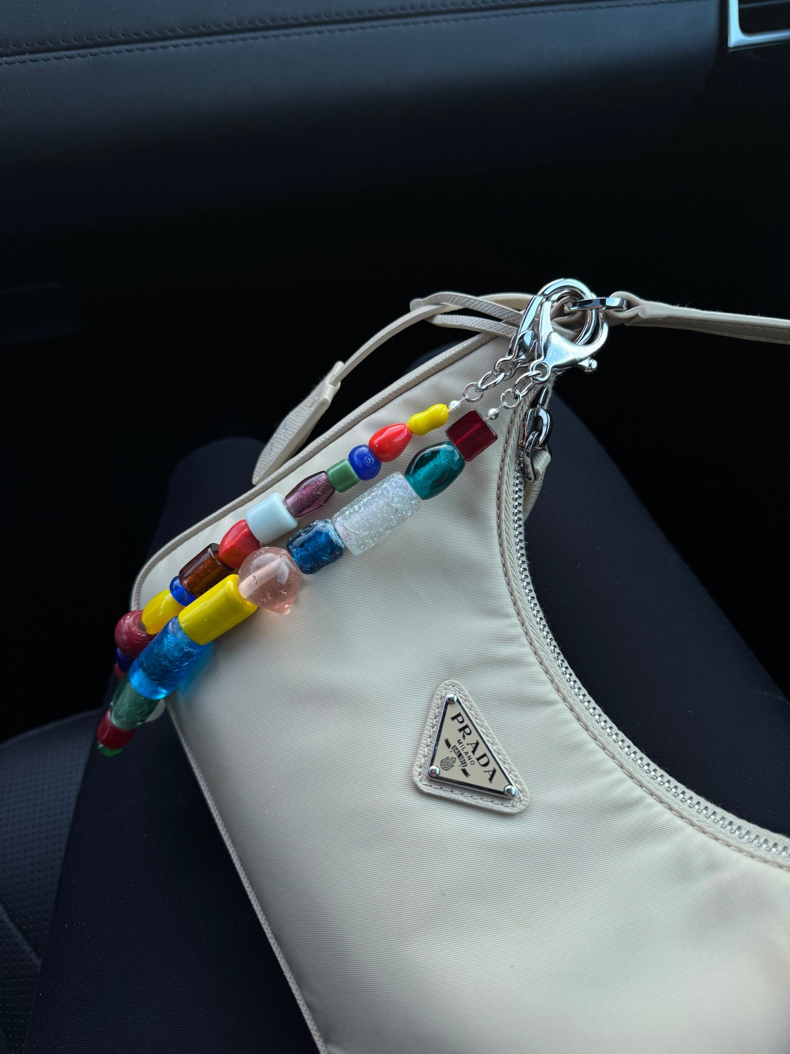 just add bag charms #prada #shoulderbag #bagcharms 

#LTKStyleTip #LTKFestival #LTKItBag