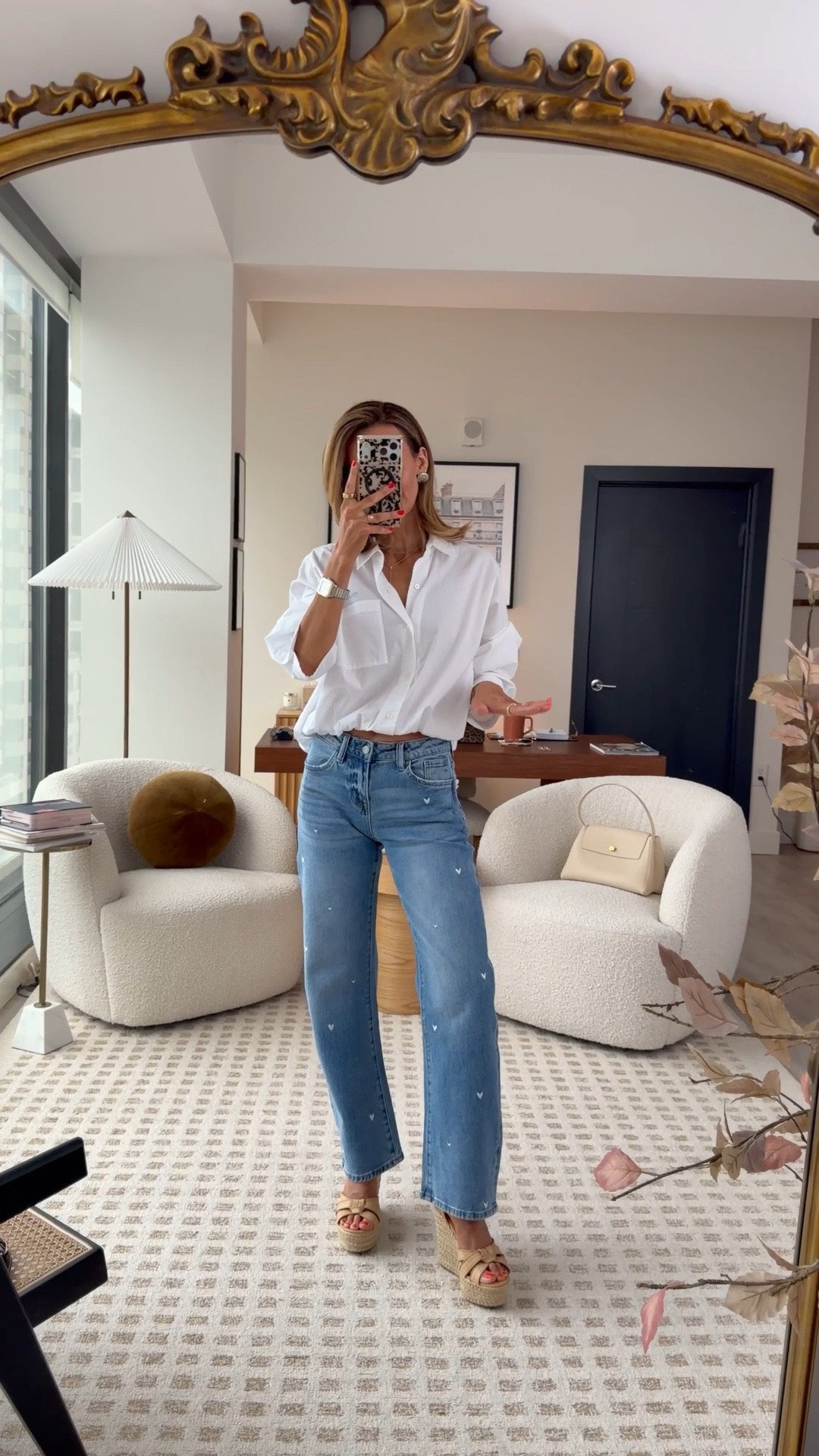 A moment for the jeans! The slight barrel silhouette with embroidered hearts is so good. This top is one of my favorites for the season. I love how the scrunch detail brings in the waist.

#LTKSeasonal #LTKOver40 #LTKootd