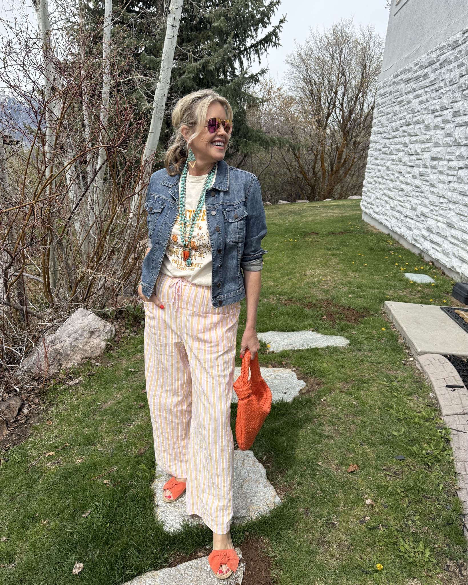 Over 50 Styling
Cool girl vibes…

Styling Tip
#3 in the Concert/graphic Tee styling Series✔️

Let Your style shine..
Wear what you love…

#3

Today we’re playing with color, a couple of Amazon finds paired with some vintage finds and the closet staple everyone has… the denim Jacket!

-Graphic tee- ( this on is not available linked similar)
- Denim jacket Kut from the Kloth tts
-pink and orange striped  cotton pant with draw string and front pocket- Amazon find tts
- suede orange bow sandals (old) linked similar
- Orange woven bag (Amazon find) such great quality and designer inspired 
- pink Ray Ban sunglasses 

To ADD texture and a POP  turquoise Jewlery 
Earring and one bracelet Mountain Beadery on Etsy 

Other turquoise bracelet Kendra Scott

Turned silver ring real and vintage- linked similar 

Turquoise beads (all real and vintage)
Linked similar

Orange horn necklace (old) linked similar 

Lip combo linked 

#LTKFestival #LTKOver40 #LTKFindsUnder50