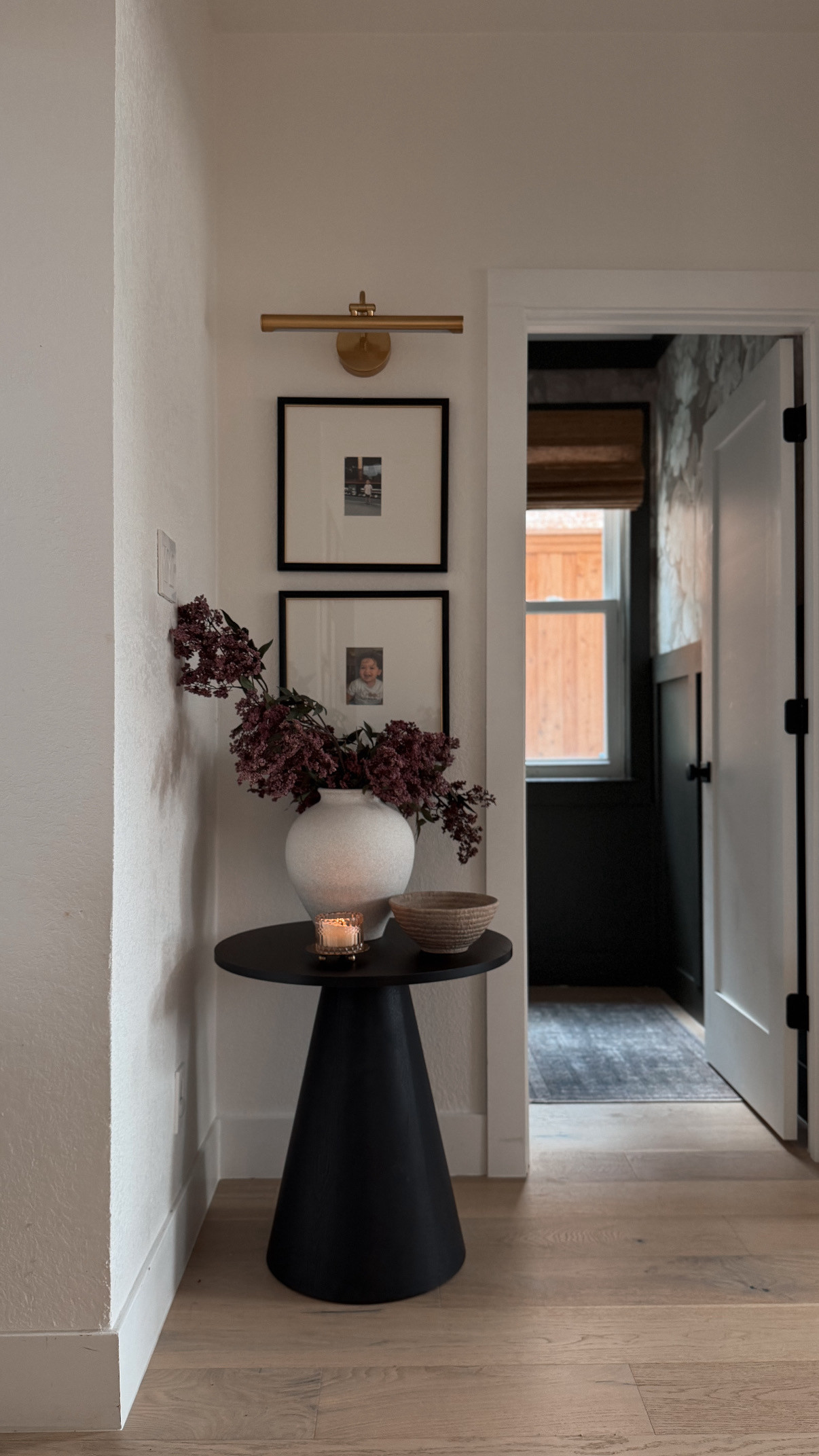 Tried out this black pedestal table as a little accent table and I love it in a corner!

hallway styling, pop maison, picture light, entryway decor 

 #LTKHome