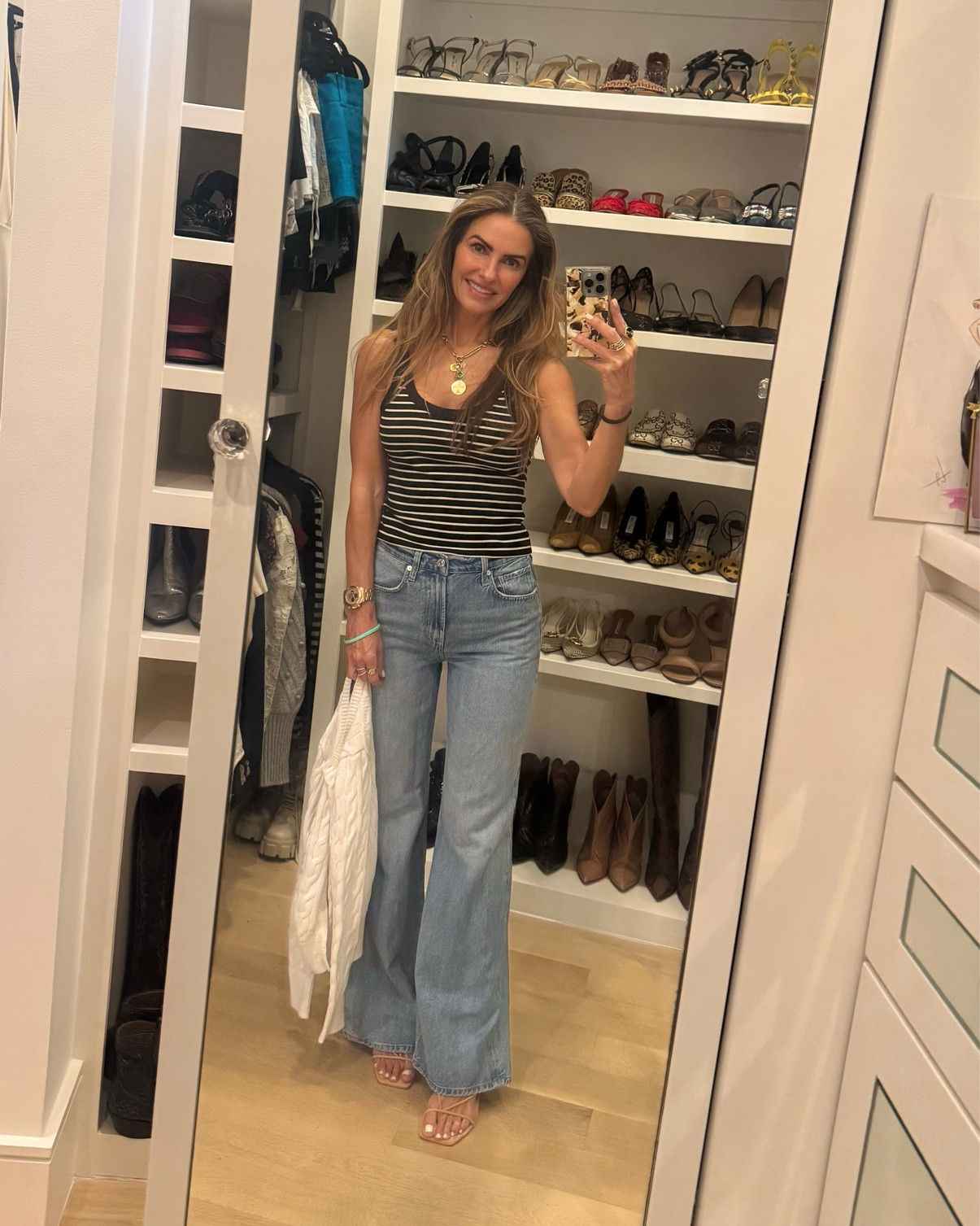 shop my casual look of the night🩵  heading out for sushi w fam at one of our favs uchiba 

shop my striped tank that i have in multiple colors that’s perfect for summer! 

runs slightly small i sized up to a M

jeans are as comfy as the sweatpants jeans but a little dressier…run tts im wearing a 25

& you need these super comfy wedge sandals that will go w dresses, skirts, jeans or shorts you name it! 

they run big tho fyi i sized down in them!

#LTKootd #LTKSaleAlert #LTKgrwm