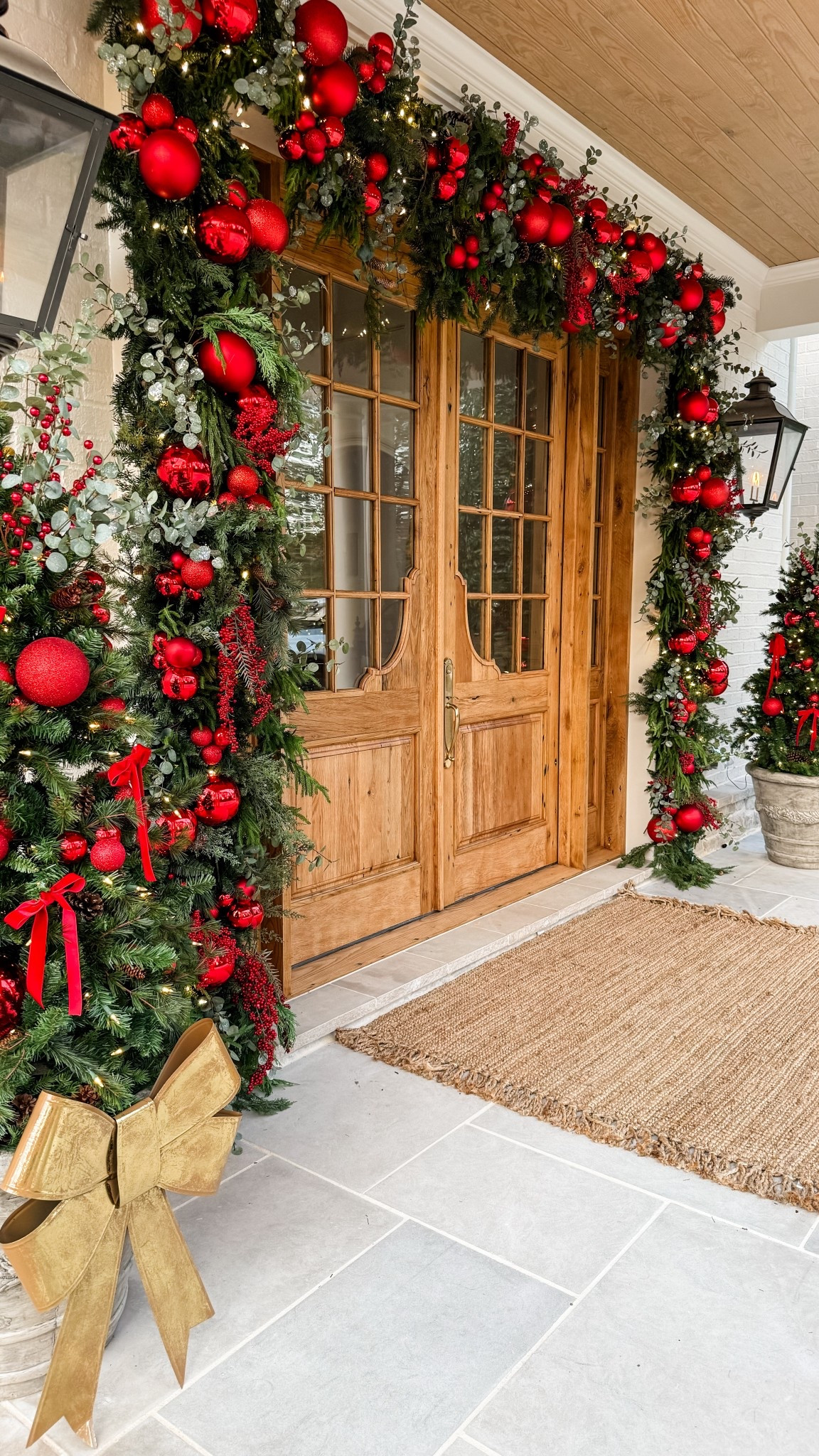 🎄Christmas Garland Arch🎄 I used several different garlands and greenery stems to achieve this look! Added red ball ornaments in several different sizes and berry stems! #LTKHoliday 

#LTKSeasonal #LTKHome