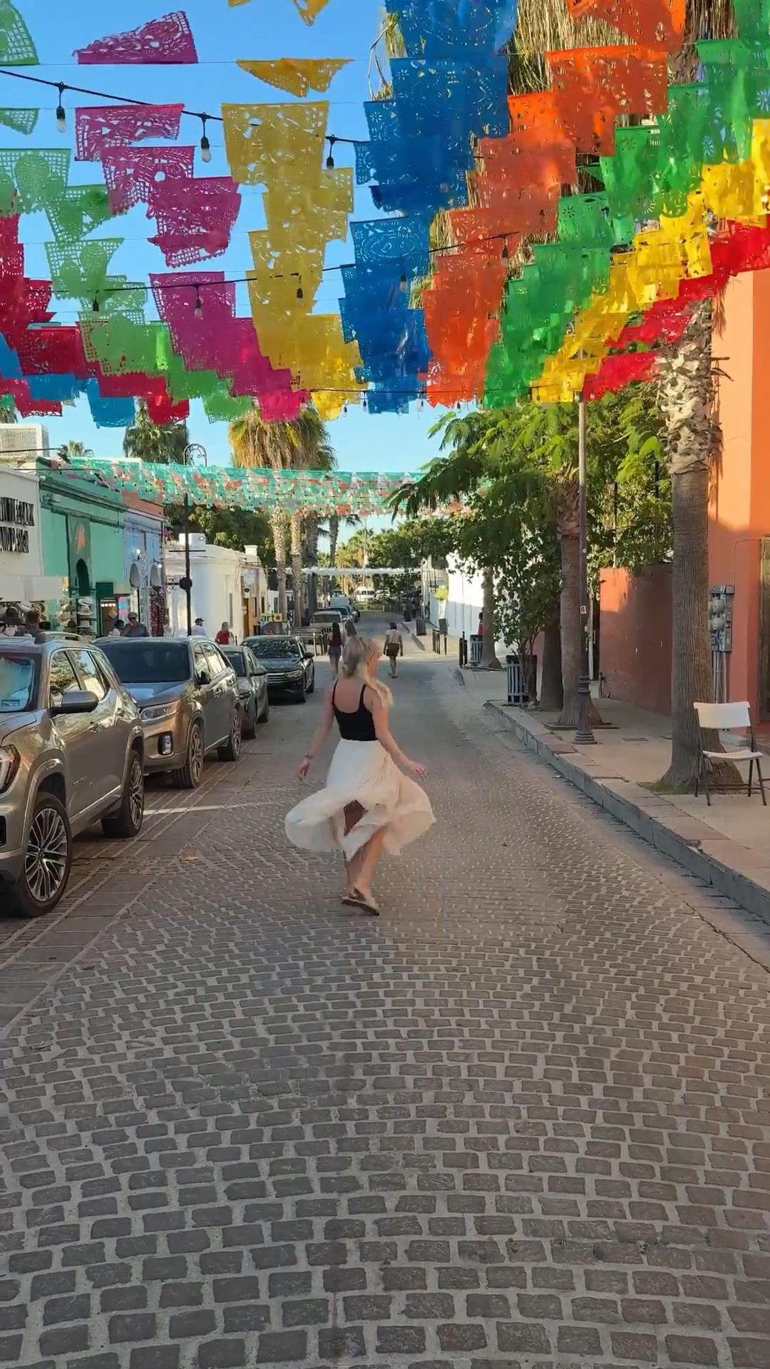 What to wear to Cabo’s Thursday Night Art Walk 🇲🇽✨

San José del Cabo’s Gallery District comes alive every Thursday night — colorful papel picado overhead, cobblestone streets, live music, art galleries, and dinner reservations after.

For this night out, I wore an easy black crop tank with a flowy neutral midi skirt & comfy slide sandals — polished but breathable for warm Cabo evenings.

My husband kept it classic with a black polo, tailored light blue shorts & neutral sandals — perfect for a casual but elevated vacation look.

Saving this for your Cabo trip!

⸻

Cabo outfit ideas, Cabo vacation outfits, what to wear in Cabo, Cabo art walk outfit, San Jose del Cabo outfit, Mexico vacation outfits, resort wear women, neutral vacation outfit, black crop tank outfit, midi skirt summer outfit, flowy skirt vacation outfit, summer night outfit warm weather, vacation date night outfit, cobblestone street outfit, chic travel outfit, travel couple outfits, men’s resort wear outfit, men’s summer vacation outfit, polo and shorts outfit men, light blue shorts outfit men, casual luxury vacation outfit, Cabo travel style, Thursday night art walk Cabo, San Jose del Cabo gallery district outfit, Mexico travel style inspiration

#LTKMens #LTKTravel