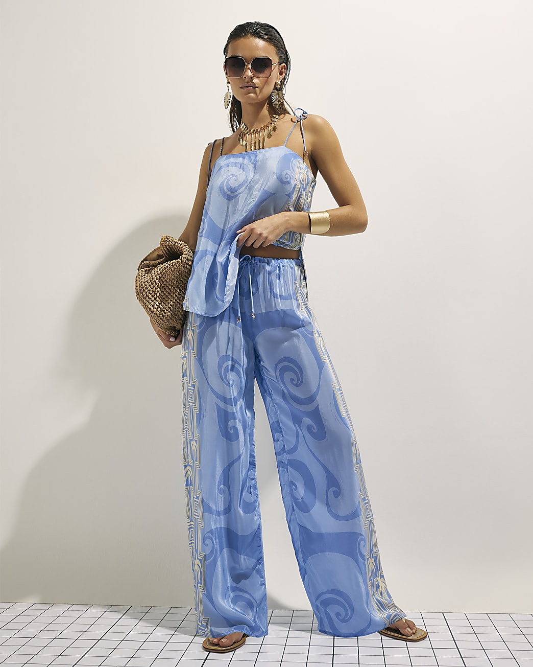 Blue Abstract Palm Print Trousers | River Island UK & IE