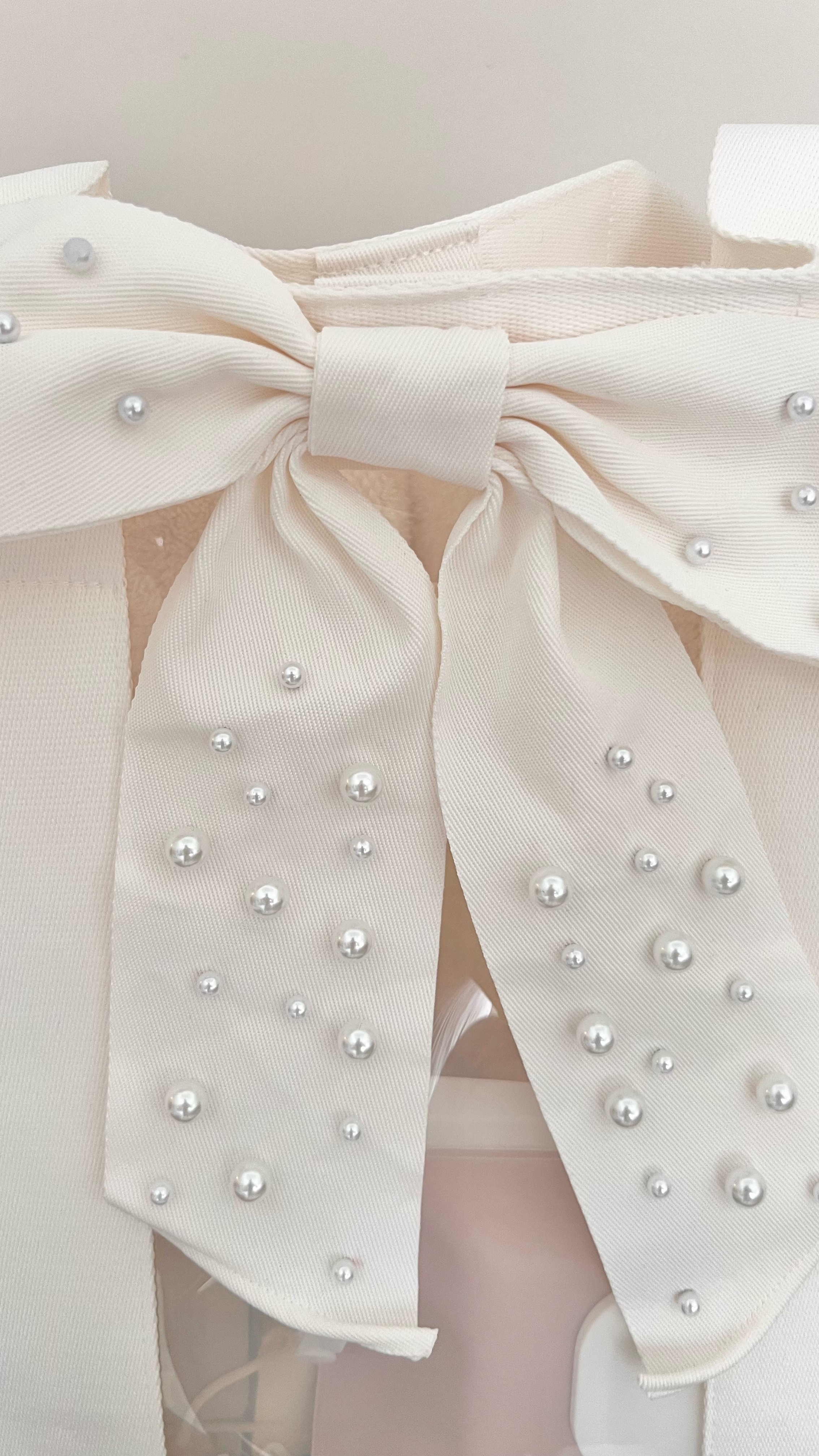 This ivory pearl bow tote is to die for!! Perfect for the brides out there🤍 

#LTKTravel #LTKItBag #LTKSummerEdit