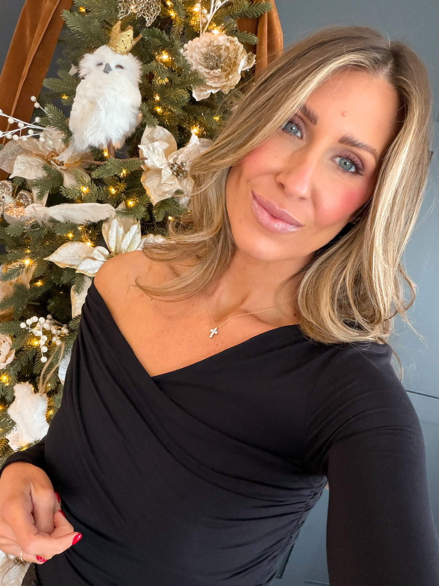 Black off the shoulder blouse styled with simple, chic pieces! I'm obsessed with how soft and flattering this top is. Perfect for everyday wear cute holiday parties cross jewelry black tops mom life affordable women's fashion black classy tops themominstyle 

#LTKdayinmylife #LTKmomlife #LTKootd