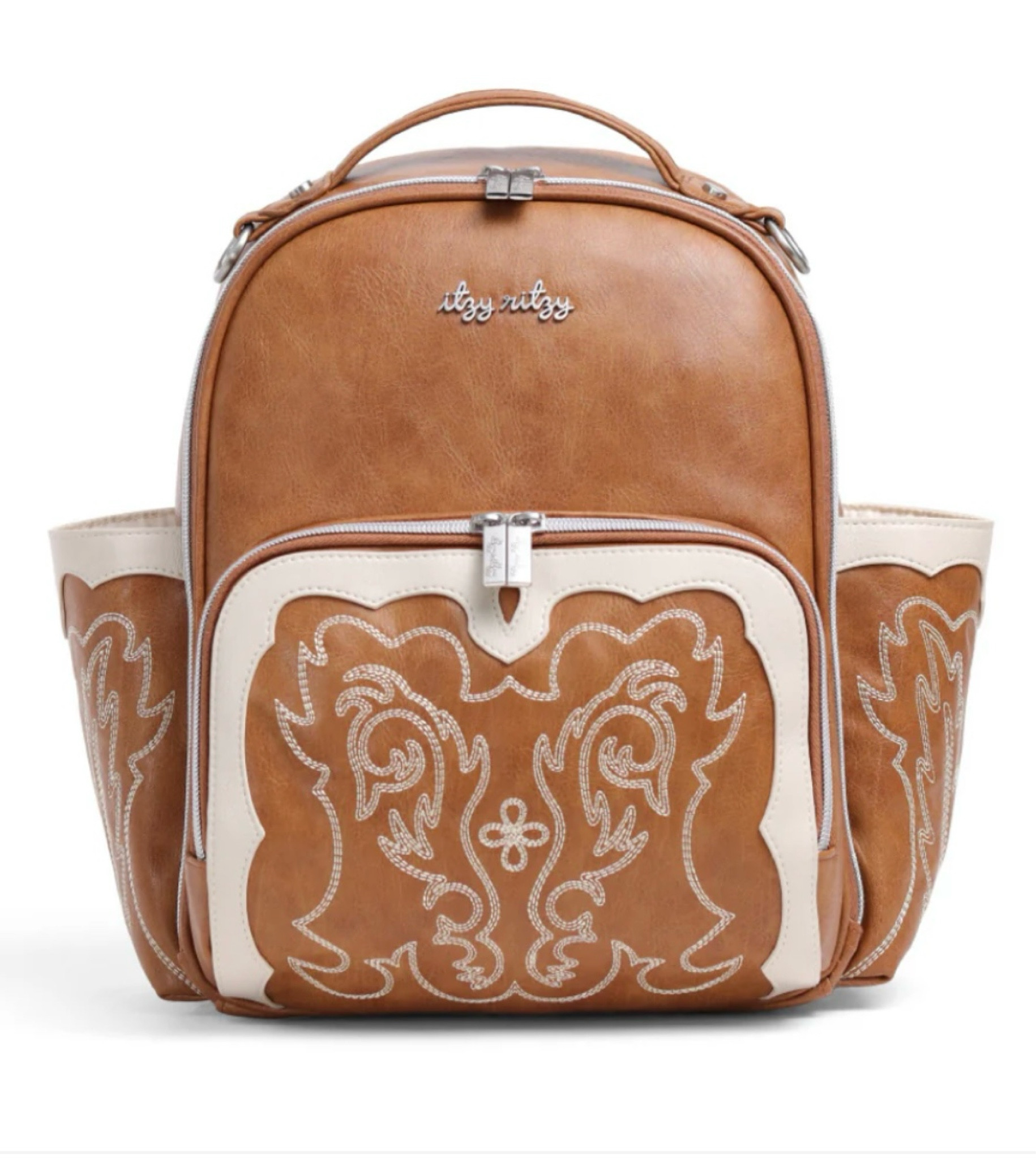 LIMITED EDITION NASH BOSS BAG!! 

I ended up getting the larger boss bag size in the cream color oat! I’m obsessed 🤠
Grab your cowboy hat and boots, Itzy Ritzy's going country! Inspired by our founder Kelly’s love of her college town of Nashville and the rich culture of country living, say howdy to our Limited Edition “Nash Collection”. The Nash diaper bags blend Itzy Ritzy's signature aesthetic with fresh, trend-forward Western design elements. With a perfect mix of rugged (+ sexy) cowboy charm and soft, coastal cowgirl style, this capsule collection is made for YOU. We're all-in on Cowboycore, so, which one (or both!) has lassoed your heart…Saddle or Oat?