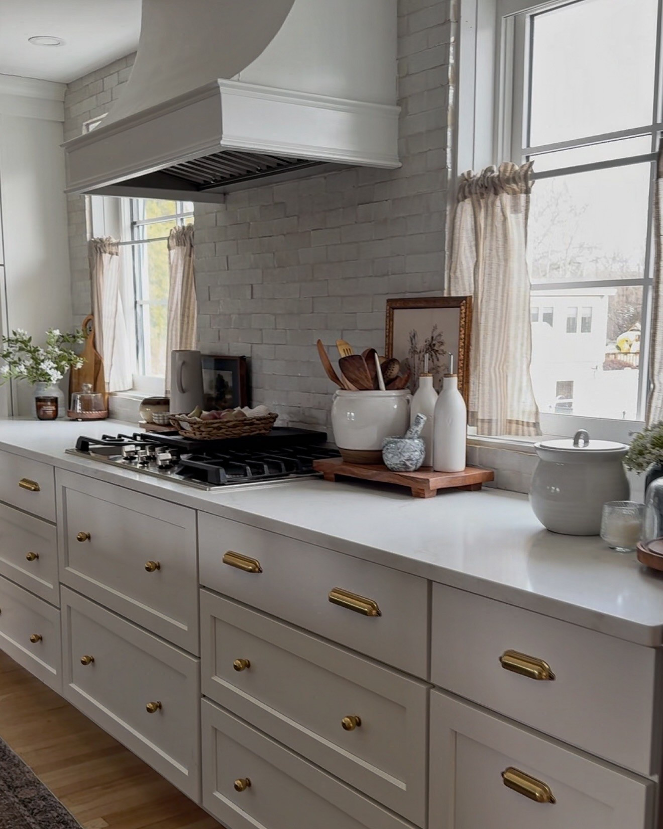I love my cook top stove and how sleek it in along these white cabinets. I have three different types of hardware in my kitchen all in gold. I just updated our runner and I got two to match in our kitchen. Space and I love having matching runners now.

#LTKStyleTip #LTKSeasonal #LTKHome