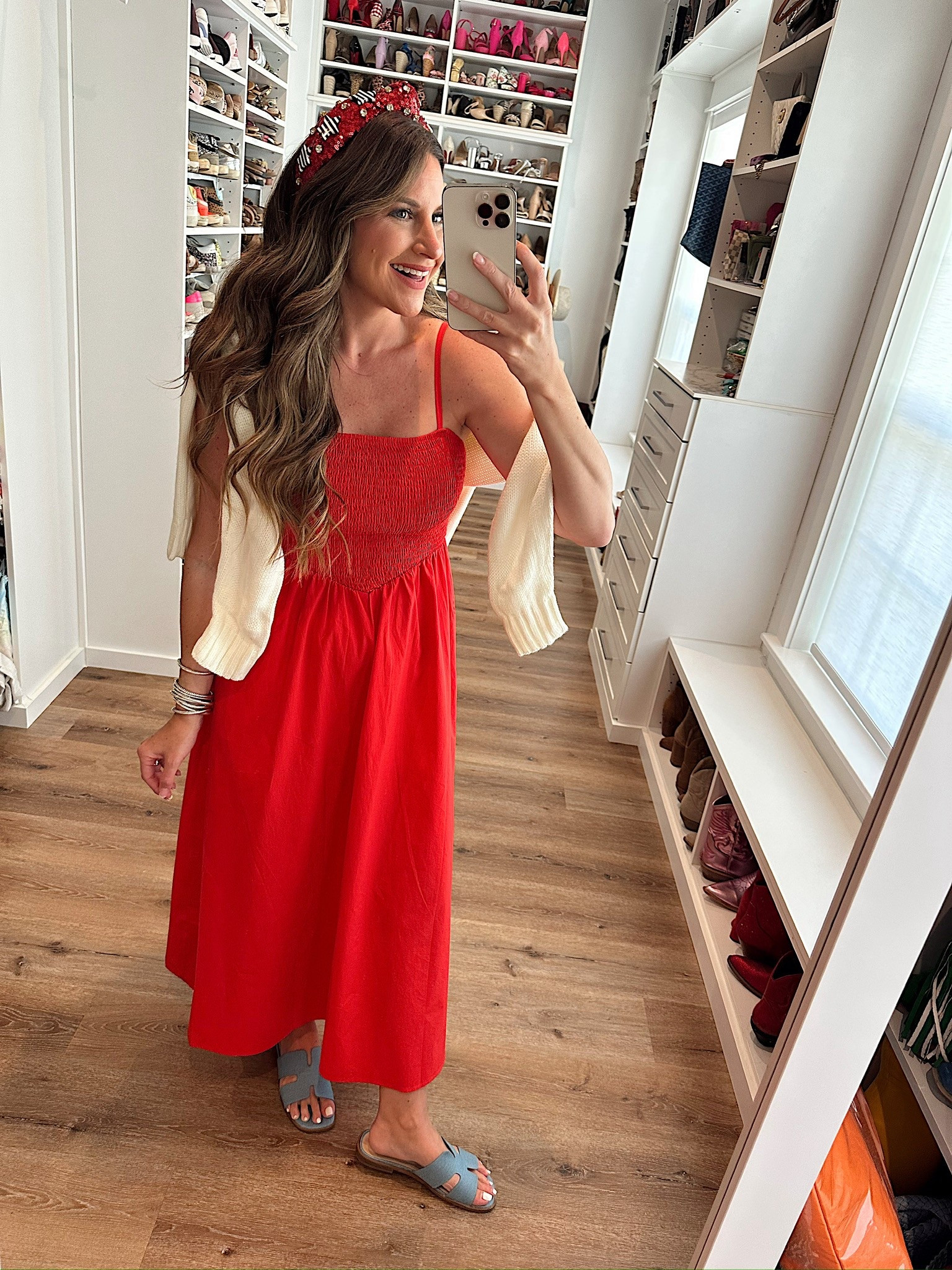 In a small smocked top maxi, large American flag sweater, headband, denim sandals and accessories for patriotic look- fits tts.

#LTKSeasonal #LTKStyleTip #LTKFindsUnder50