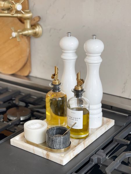 HOME \ kitchen range setup: marble tray, salt & pepper pinch pots, oil dispenser jars and grinders.

Amazon 
Decor 
Cooking 

#LTKfindsunder50 #LTKhome