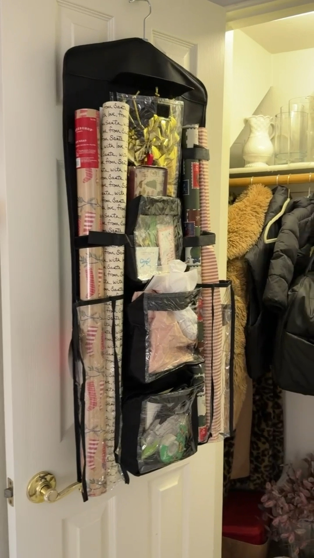 Hanging wrapping paper storage! Perfect for packing up Christmas wrapping and keeping gift supplies organized all year long!

#LTKHome #LTKHoliday