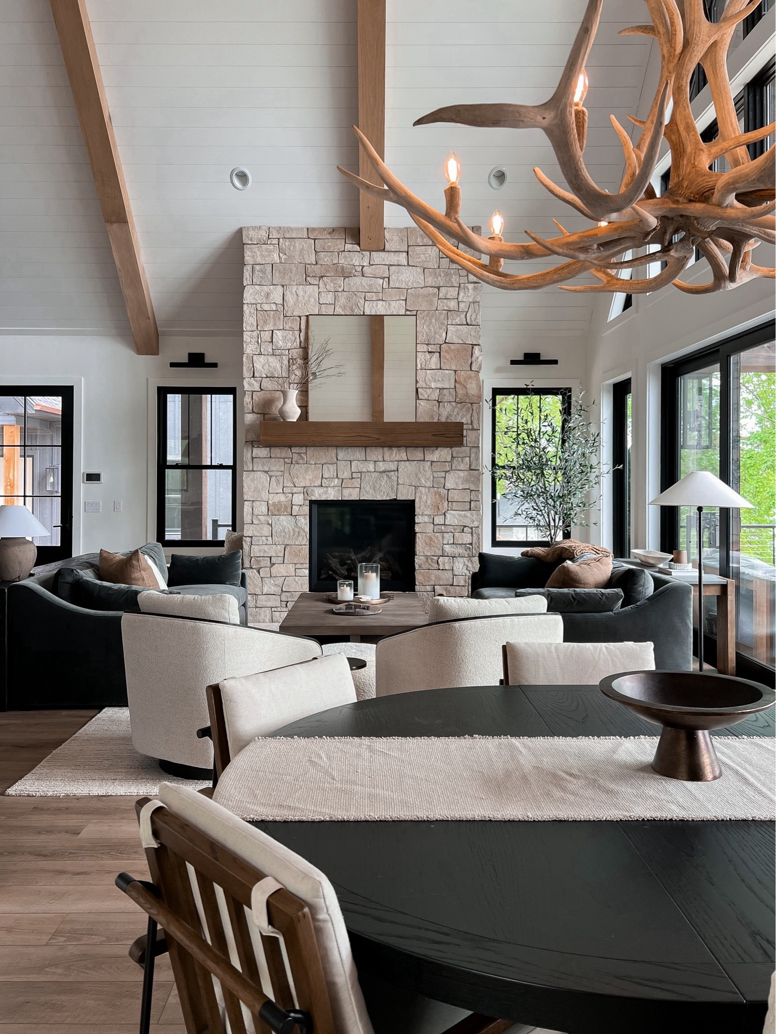 Living room & dining room at the lake. We love have an oval table that extends when we have guests. The living room is centered around the beautiful fireplace with 2 sofas flanking each side 

#LTKHome #LTKStyleTip #LTKSummerSales