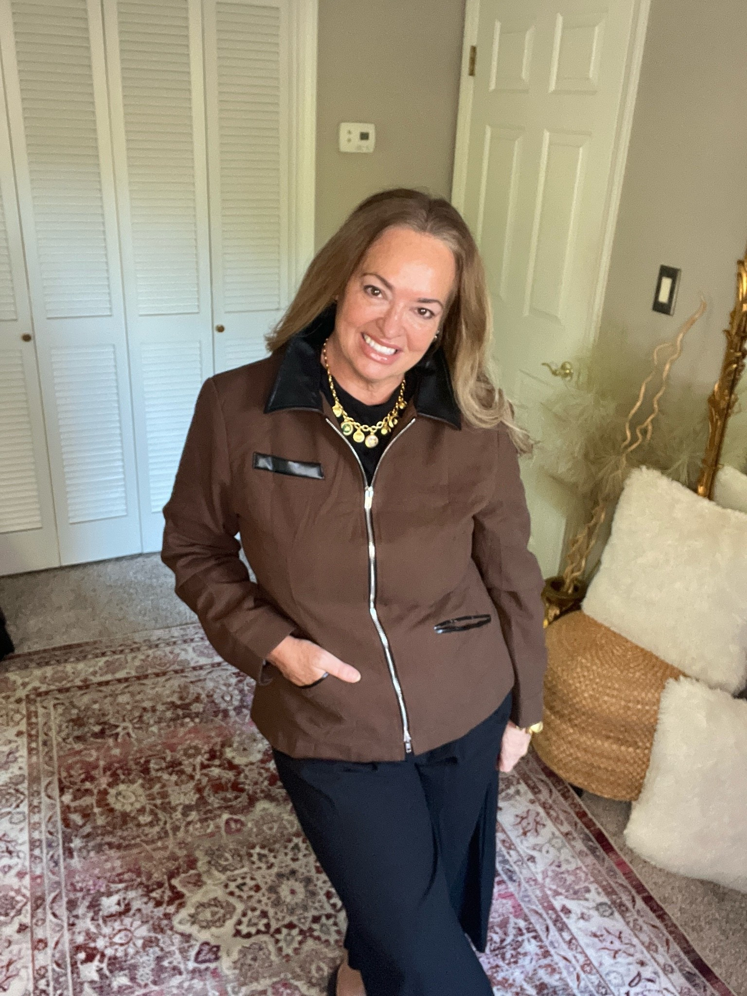 Updated barn jacket with fitted silhouette and faux leather trim details. It looks designer!