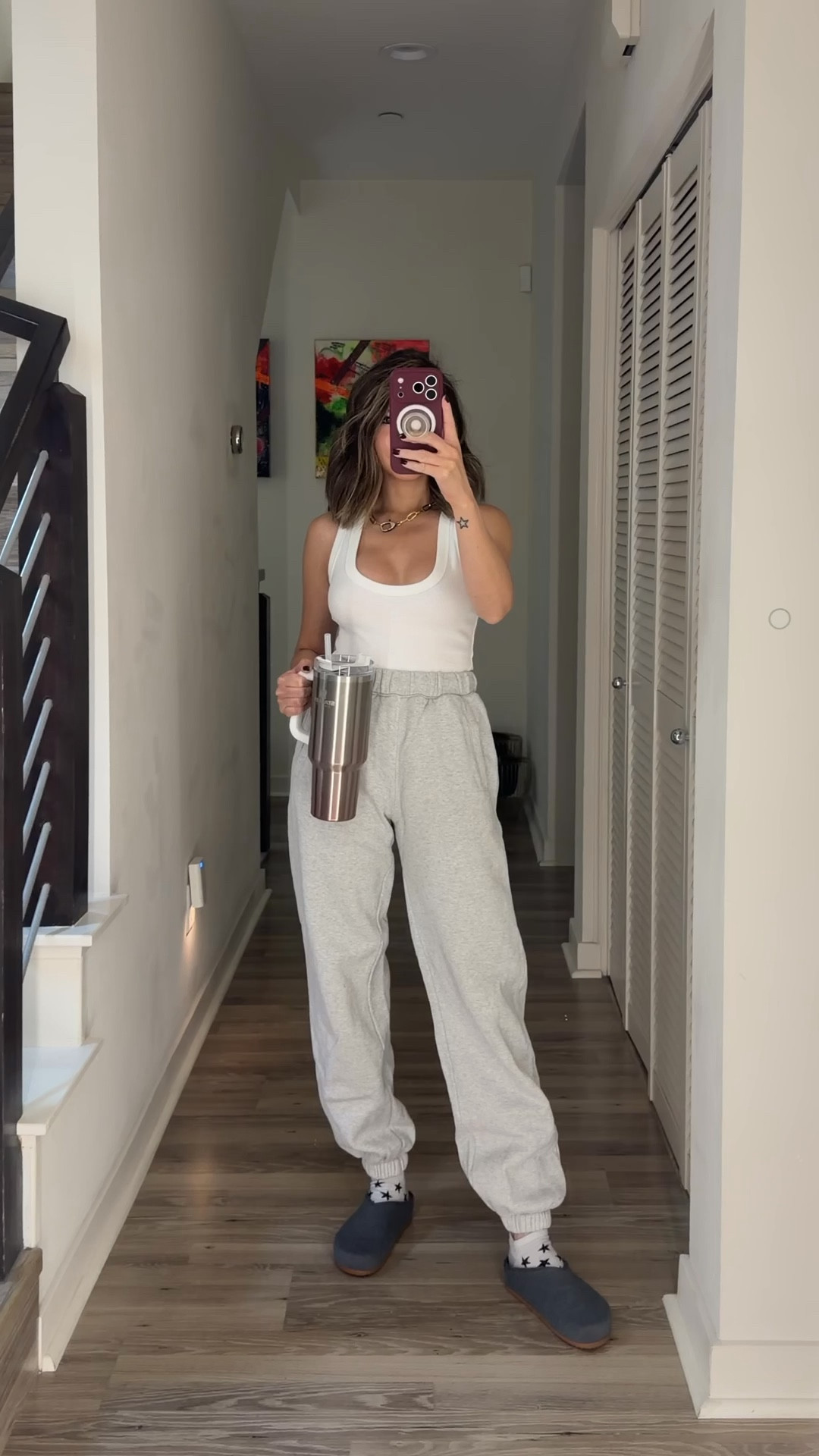 Monday vibe working from home ⚡️ Love a good white tank. These sweatpants are so comfortable. I am guilty of owning them in almost every color. These clogs are so cozy—perfect for running errands and travel days. Getting my daily water intake with my Stanley tumbler—I love all the fun colors they have. 

Loungewear, work from home outfit, casual outfit, sweatpants, tank top, clogs, The Stylizt 



#LTKdayinmylife #LTKWorkwear #LTKootd