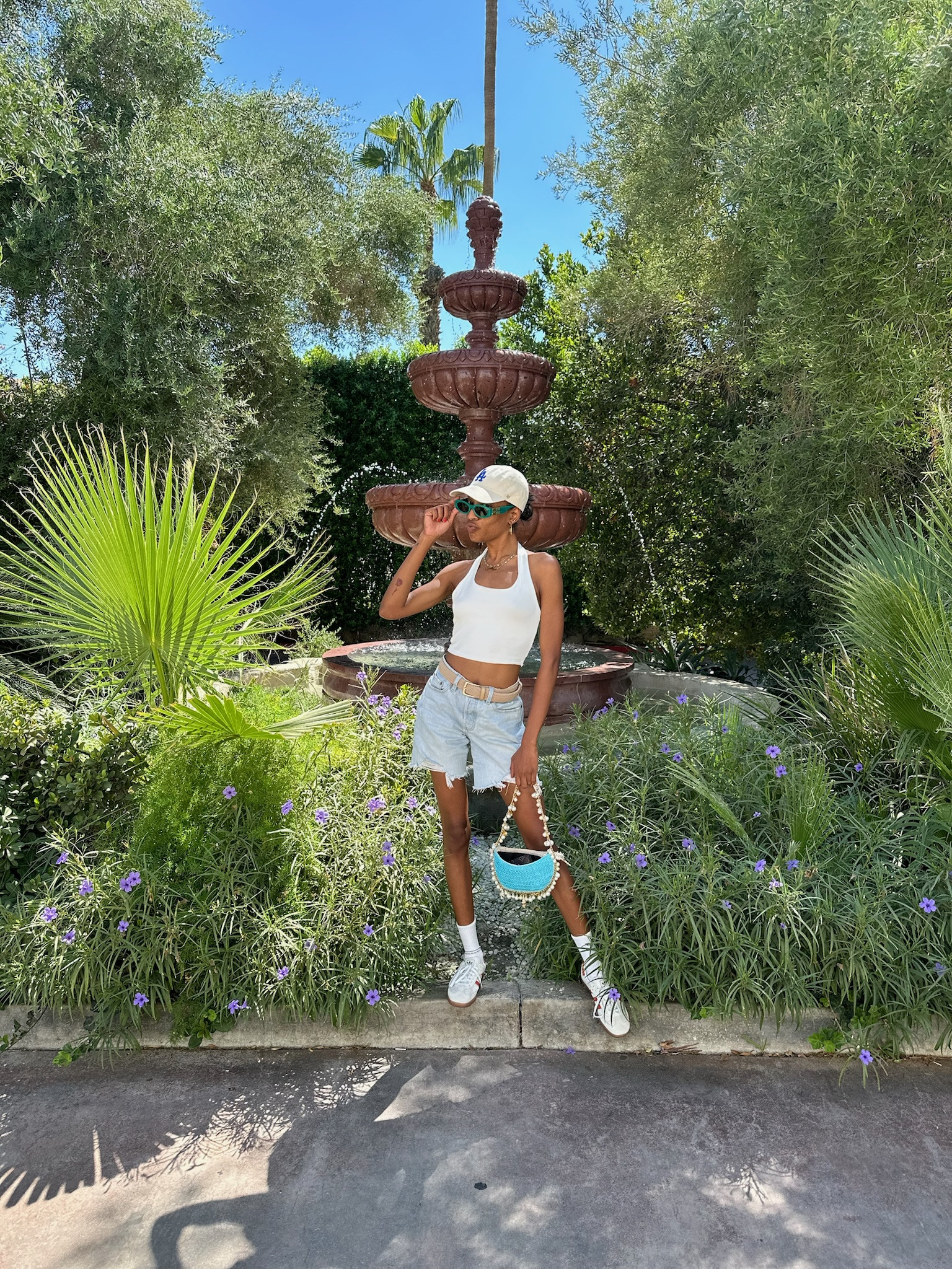 Palm Springs OOTD. It was so hot this day 🥵 Shorts in size 26
✨Top - forever 21 white halter top
✨shorts - Levi’s 90s shorts in light wash 
✨Sneakers - Adidas Samba in Crystal White/Preloved Red/Gum size 7
✨Bag - seashell purse from boutique same one linked from Walmart



#LTKShoeCrush #LTKItBag #LTKStyleTip