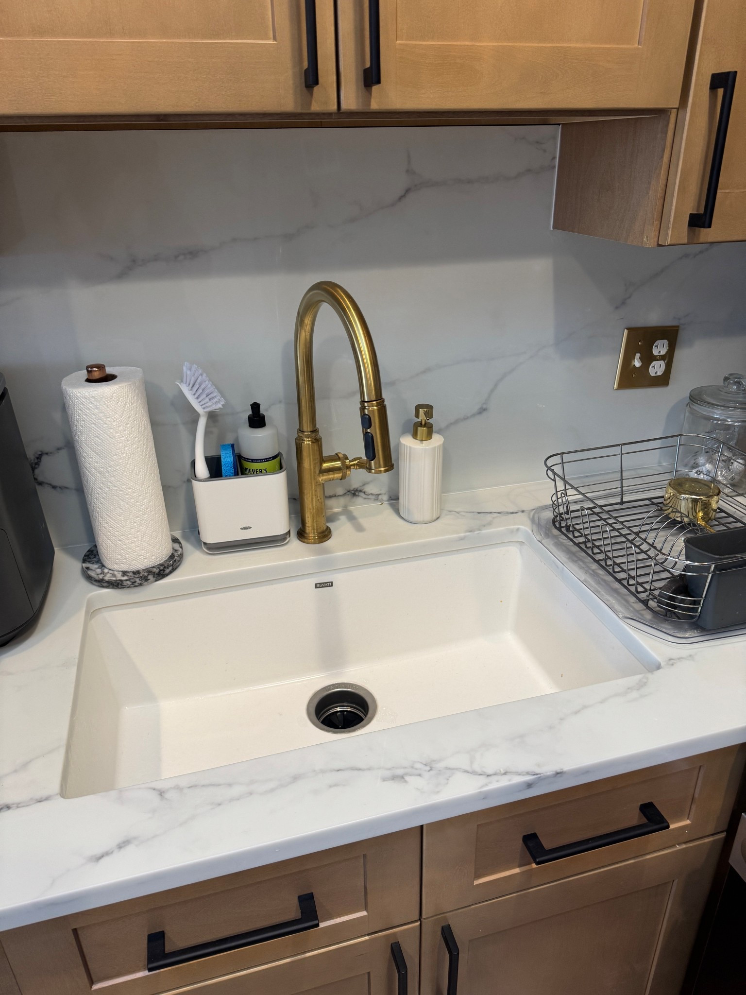 A little close up of the details of our kitchen sink! I got the faucet, sink and cabinet hardware from the Home Depot and love how it turned out. I upgraded the light switch cover and also added a sponge caddy and paper towel holder  

#LTKFindsUnder100 #LTKHome