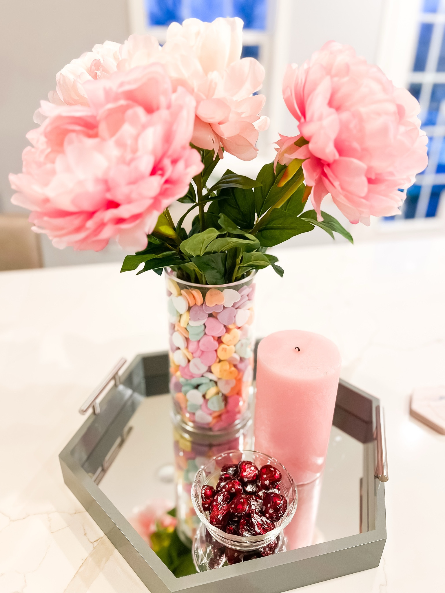Easy to assemble floral arrangement for Valentine’s Day! Use large candy hearts in a larger vase with a smaller vase in the center. I love the large stems of these fake flowers!
Valentine’s Day, v day, flower arrangement

#LTKHome #LTKFindsUnder50 #LTKSeasonal