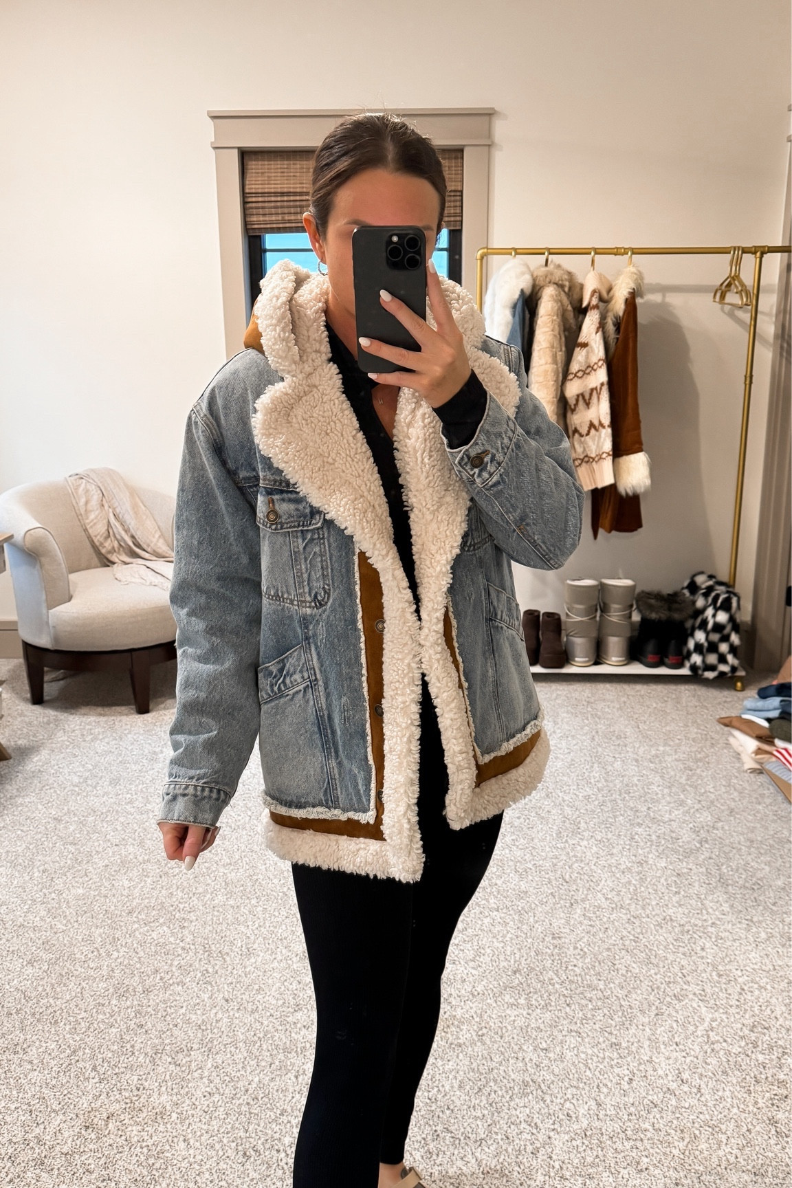 Size down. I normally wear a small and XS fits perfectly! This denim and Sherpa jacket would be perfect for Jackson Hole in the winter  