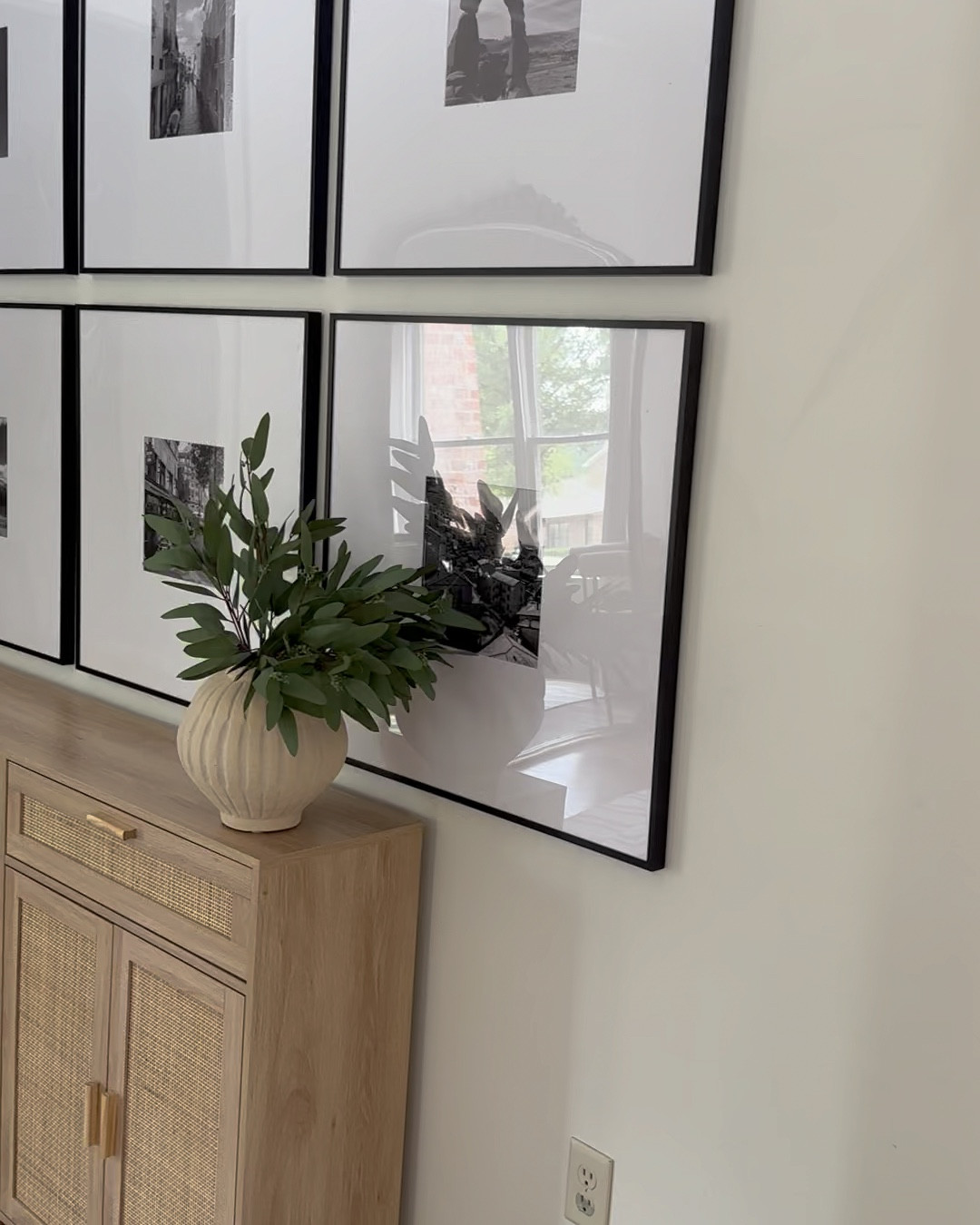 DIY gallery wall complete! It’s so nice to have pictures of our family trips off our phones and on the walls of our home. @frameiteasy frames are so beautiful and easy to use. Here are my exact frames: 
    Art Size: 10" x 10"
    Outside Frame Size: 27 3/16" x 27 3/16"
    Style: Ashford, in Satin Black
    Matting: 8 1/2" Smooth White (White Core)
    Cover: Clear Acrylic
    Backing: Acid Free Foamcore
#frameiteasy 

#LTKVideo #LTKTravel #LTKHome