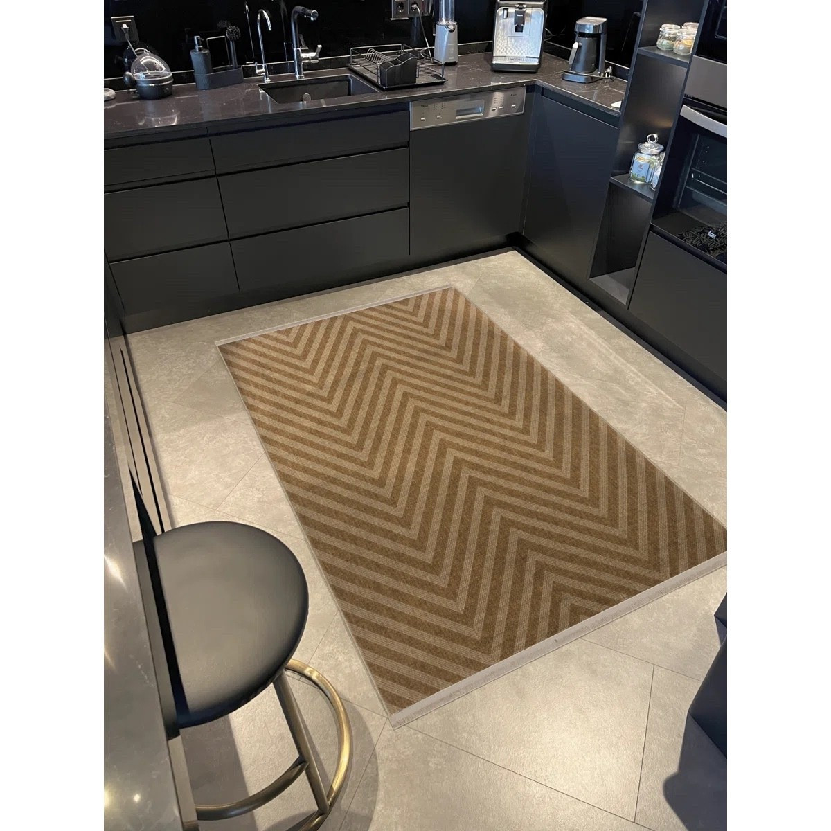 Such a simple way to warm up a modern kitchen. This neutral chevron kitchen runner rug adds texture and contrast against dark cabinets while still feeling clean and minimal. Perfect for in front of the sink or prep area, it softens the space, feels great underfoot, and ties in beautifully with black, stone, and mixed-metal finishes. #wayfair

#LTKHome