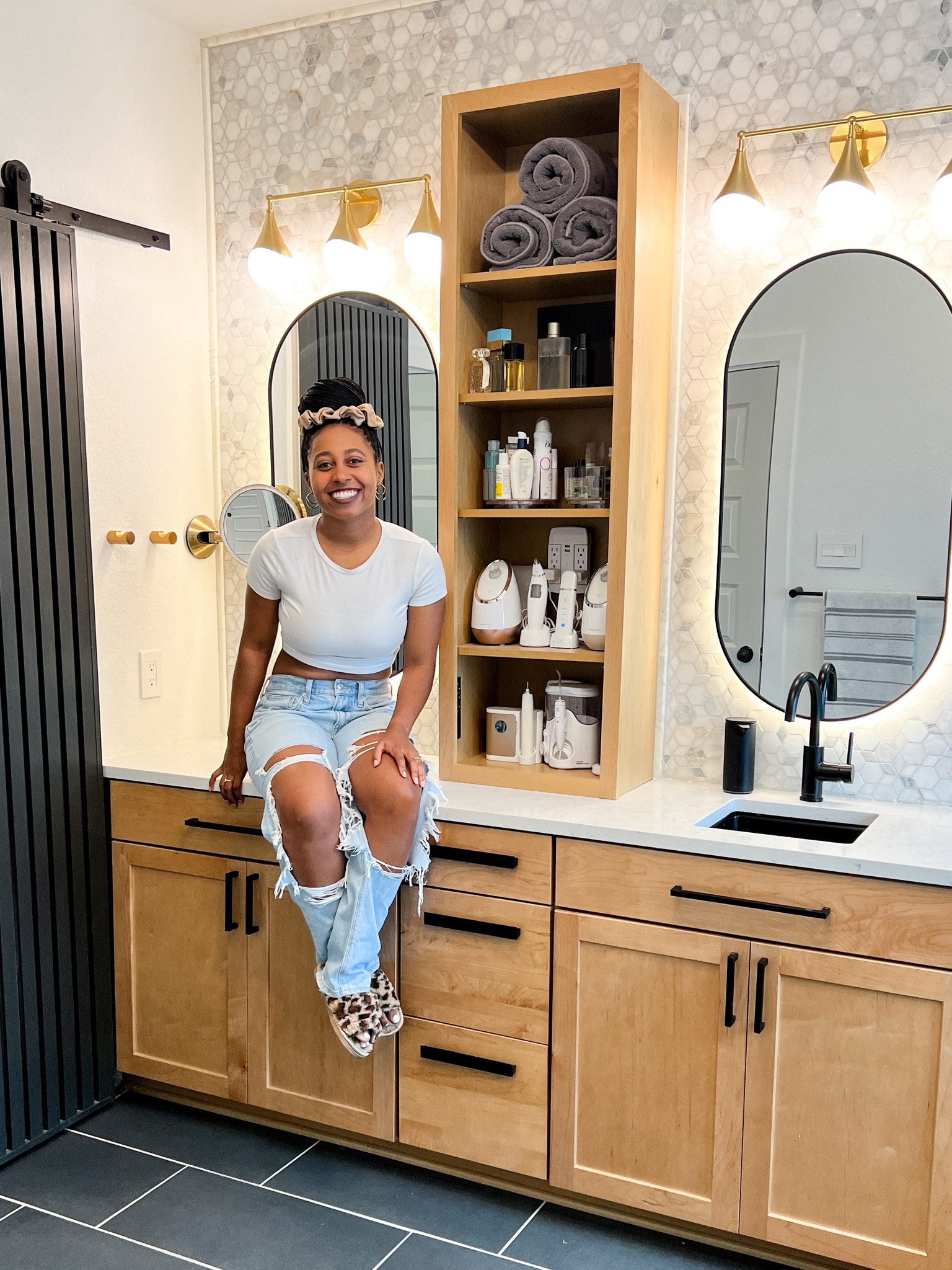 our primary bathroom renovation is complete and I couldn’t be happier with the new tile, black and gold accents, and lighted mirrors!

#LTKhome