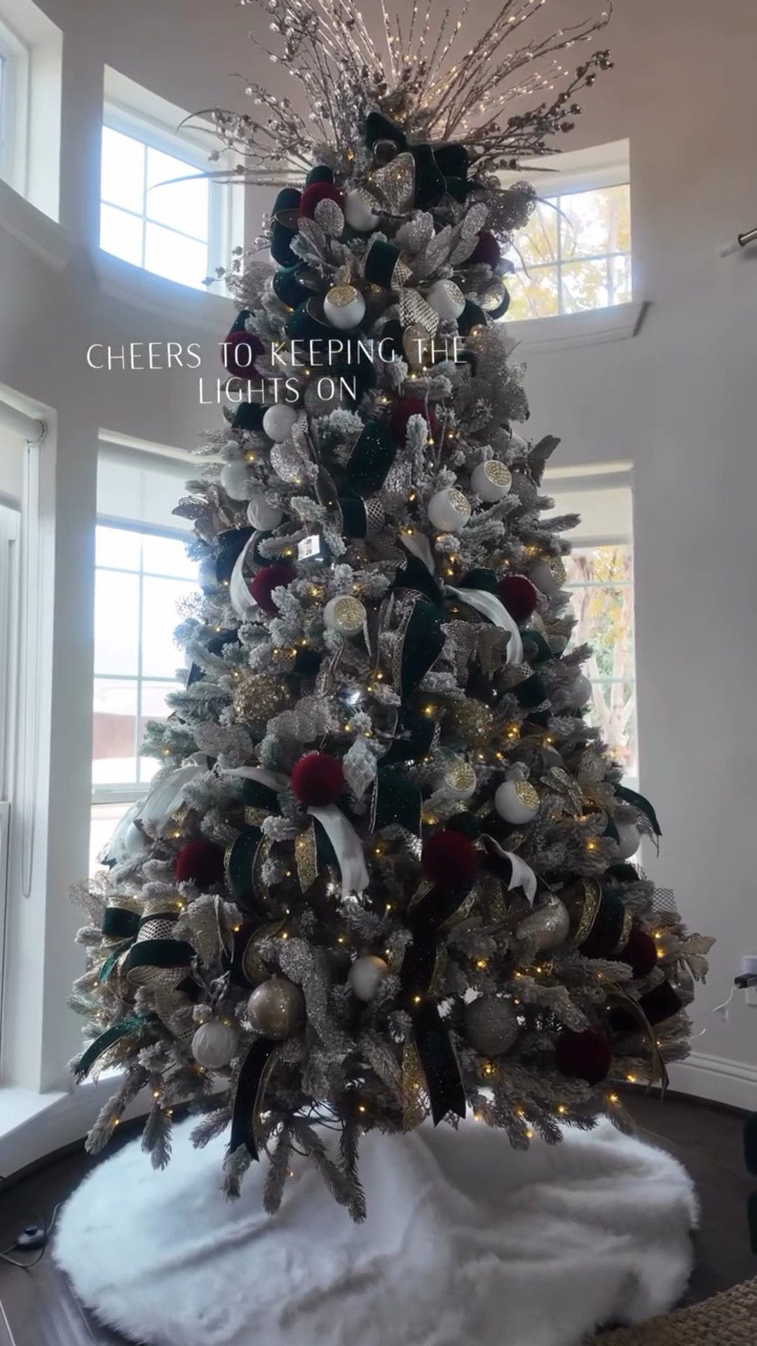 Cheers to keeping the tree lights on a finding a tree skirt that was large and didn’t break the bag. 

For years I struggled to find a tree skirt for a reasonable price that was large enough for my tree not anymore. 

Need a large tree skirt comment “shop” and I’ll DM you a link

#christmastreedecor #christmastreedecorating #christmastreedecorations #flockedchristmastree #christmastreeskirt