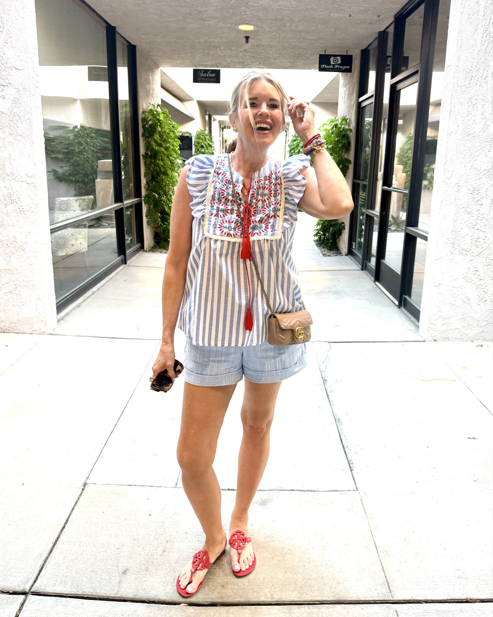 The cutest top and it’s under $30

The stripes, the embroidery details and tassels with a ruffle tank sleeve!! So cute and great quality fits tts wearing a small 

The perfect chambray/linen light blue shorts by Gibsonlook fit tts in a small save 10% off with code DARCY10 

Red Tory Burch millers 

Gucci marmot bag 

Julie Vos light blue stud earrings, necklace, ring and bracelets 

Red Budha girl bracelets all weather water proof

#LTKFindsUnder50 #LTKStyleTip #LTKOver40