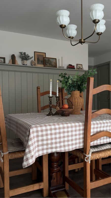 Dining nook, gingham table cloth, door knob, mil glass light, chair pad 

#LTKhome