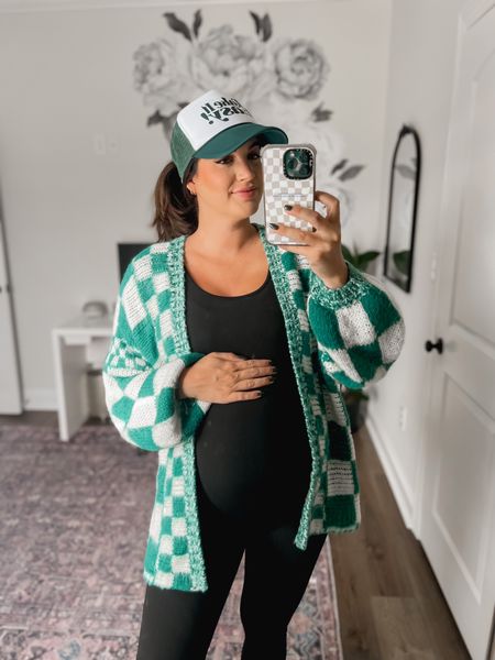 Obsessed with this outfit! Love the green colors and this maternity jumpsuit is so affordable and perfect for the third trimester. I’m 35 weeks and in a size M. Sweater code: teacherintulle25 for their whole site 

Bump style maternity cool mom style trucker hat 

#LTKfindsunder50 #LTKsalealert #LTKbump