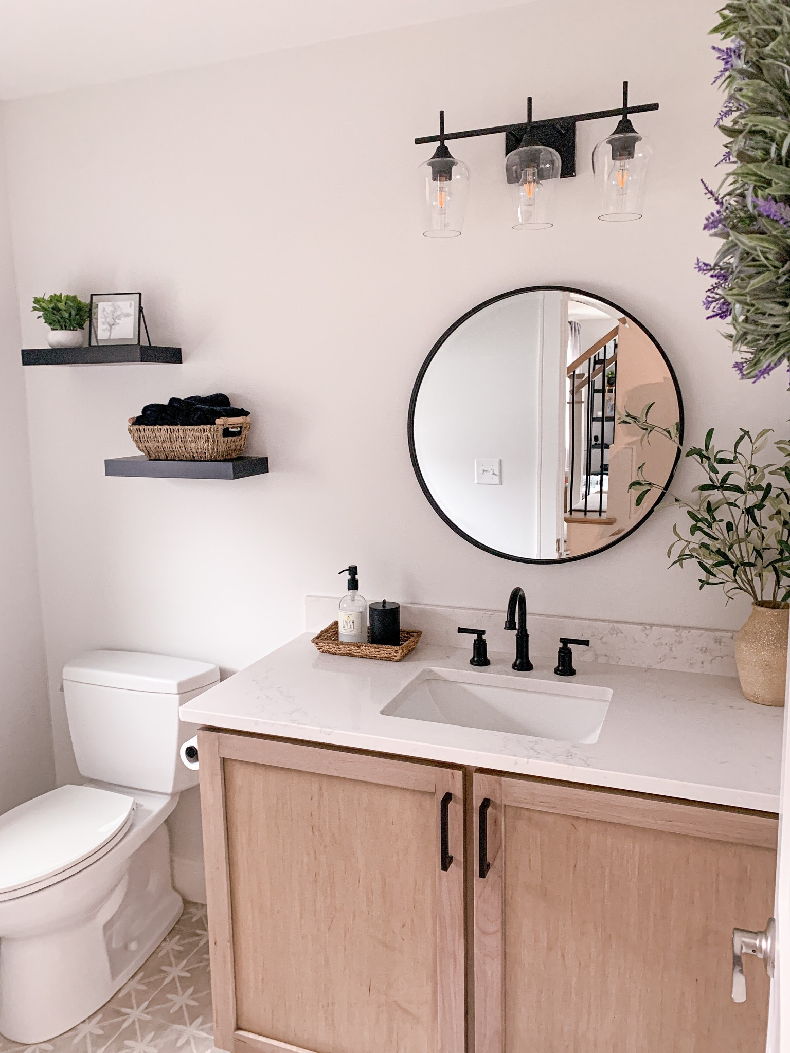 Bathroom, wood cabinets, circle mirror, floating shelves, lavender wreath, bathroom decor, minimalist style, neutral bathroom, home decor, bathroom lights, light fixture, vanity light

#LTKU #LTKFind #LTKhome