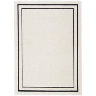 Essentials Ivory/Black 6 ft. x 9 ft. Solid Contemporary Indoor/Outdoor Area Rug | The Home Depot