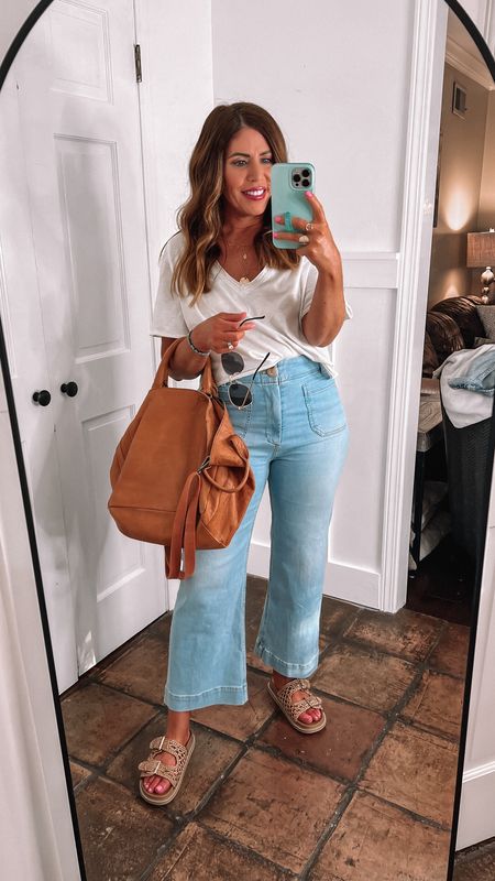 Super basic but cute outfit for summer! 
My favorite wide leg cropped jeans from Anthropologie- wearing my true size 28

Look for less sandals from target - tts

Oversized, distressed, leather satchel from free people 

Cropped V-neck from Aerie - wearing my true size medium

Ray-Ban round aviators 

#LTKOver40 #LTKStyleTip