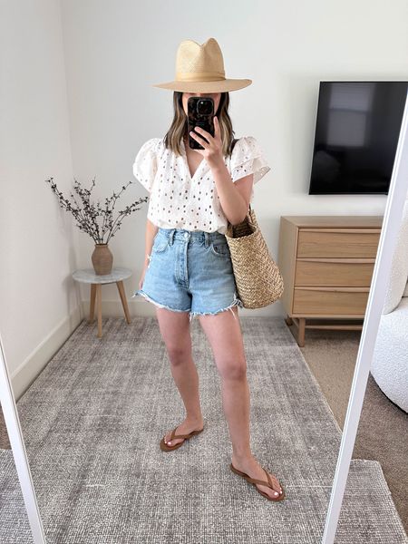 Summer outfit ideas. Cute tops for summer. This top is stunning! And petite-friendly. 

Trovata top xs
AGOLDE Dee shorts 26. Sizes up 2 sizes. 
Tkees boyfriend sandals 5
Janessa Leone hat small
Gap tote 

#LTKunder100 #LTKitbag #LTKshoecrush