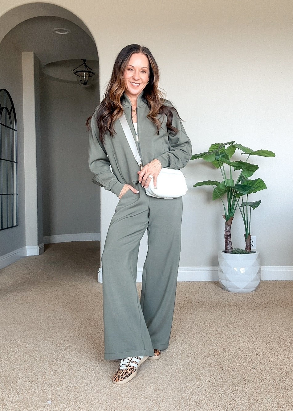 New SPANX track set with pintuck details & a full zip jacket ✈️ The pants come in petite, regular & tall, making this such an easy travel or everyday outfit.

New customers can save 10% with code HOLLYFXSPANX.

For reference: I’m 5’1”, 106 lbs. 
XS tank
XS Track Jacket
XS Petite pants
Shoes TTS
Everything is unaltered.

SPANX track set, petite pants, travel outfit, comfy travel outfit, women’s tracksuit, matching set, fall travel outfit, petite fashion, fashion over 50, women over 50 fashion, everyday style

#LTKootd #LTKPetite #LTKTravel