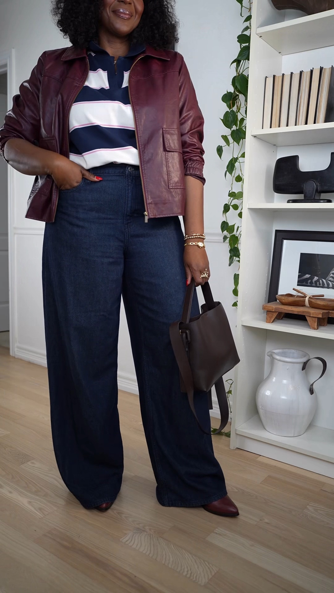 you're into casual everyday fall outfits, this look is such an easy one to recreate. I styled a navy and white rugby shirt with wide-leg jeans for that relaxed, cool-weather vibe. The burgundy faux leather jacket and matching shoes add the perfect fall pop of color, and the brown bag ties everything together. It's simple, comfy, and still feels put-together for busy days. This is one of those effortless fall outfit formulas you can repeat over and over with pieces you already own. Would you wear this? #plussize #outfitideas #fallfashion

#LTKMidsize #LTKCyberWeek #LTKootd