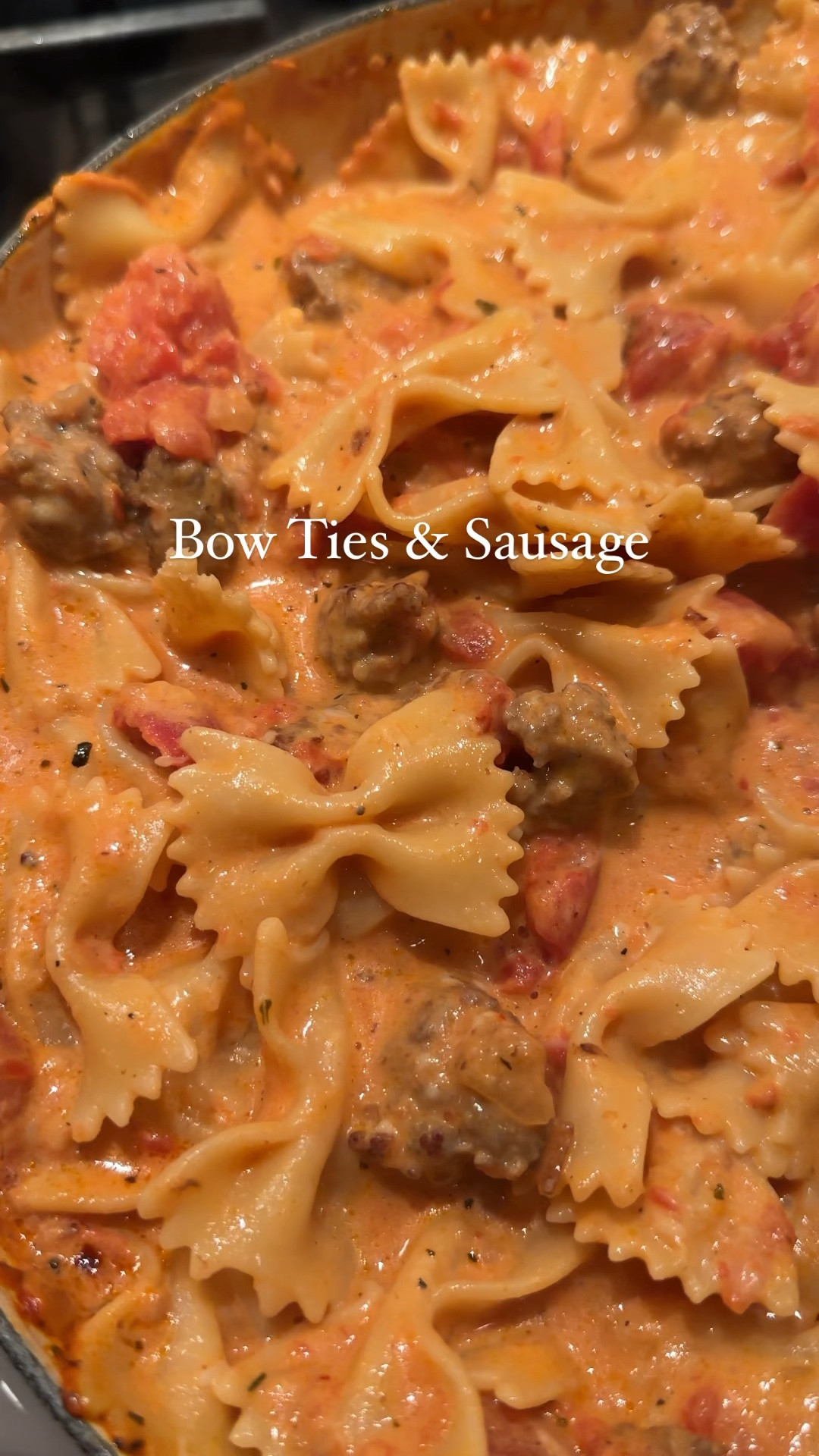 Bowties & Sausage

1 lb bowtie pasta
1 lb Italian sausage, without the casing
2 tbs olive oil
1/2 tsp red pepper flakes
1 medium onion, diced
3 cloves of garlic, grated
2 28 oz cans of Italian plum tomatoes
1 1/2 c. whipping cream
1/2 tsp salt
1/3 cup grated parmesan

1. Heat oil, add onion, sausage, and red pepper flakes until sausage has browned and cooked through. 
2. Add garlic and stir for 1 minute.
3. Add in two cans of tomatoes, salt and pepper. Let it come to a simmer. The tomatoes will soften, at this time, break them into smaller pieces with a spoon.
4. Let the sauce simmer on low for 20 minutes.
5. Turn to low, and add in the heavy cream and cheese. Stir until combined—taste for seasonings.
6. Add pasta to the sauce, top with cheese and serve. 