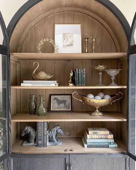 Holiday cabinet styling in my Arhaus Hattie arched cabinet! Most of this is vintage, but linked similar decor pieces I’ve found!

#LTKfindsunder100 #LTKstyletip #LTKhome