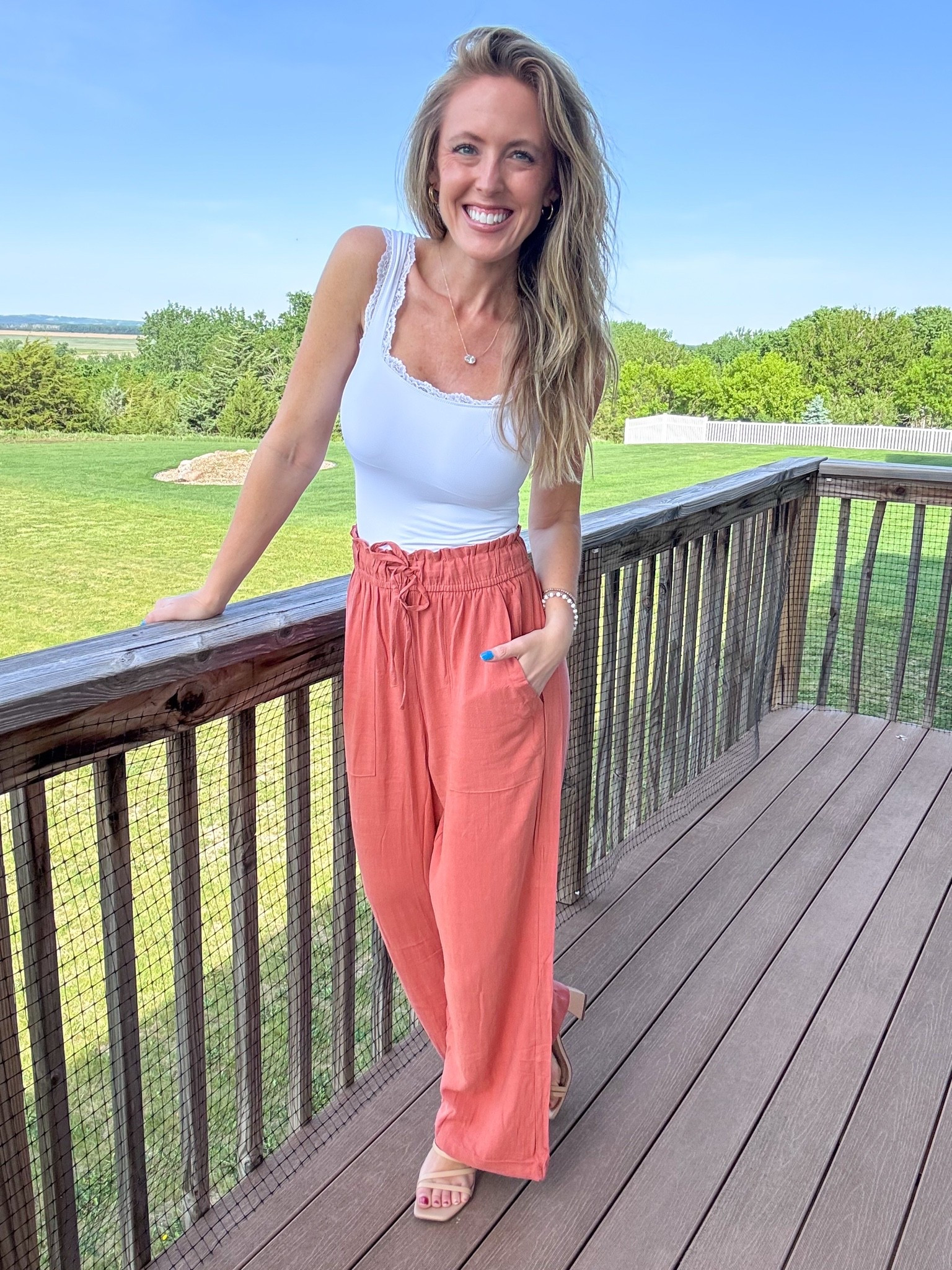 These rust wide leg pants are so comfortable and cute! 🧡 Can’t get over how good the fit is! Wearing a small in the pants and xsmall in the top.

As an Amazon Influencer I earn commission on qualifying purchases.

Rust summer pants, comfortable dress pants, mom style, lace trim tank with built-in bra, summer styles, spring fashion 2026, casual day look, wear to work pants, office pants, business casual pants

#LTKootd #LTKOver40 #LTKMidsize