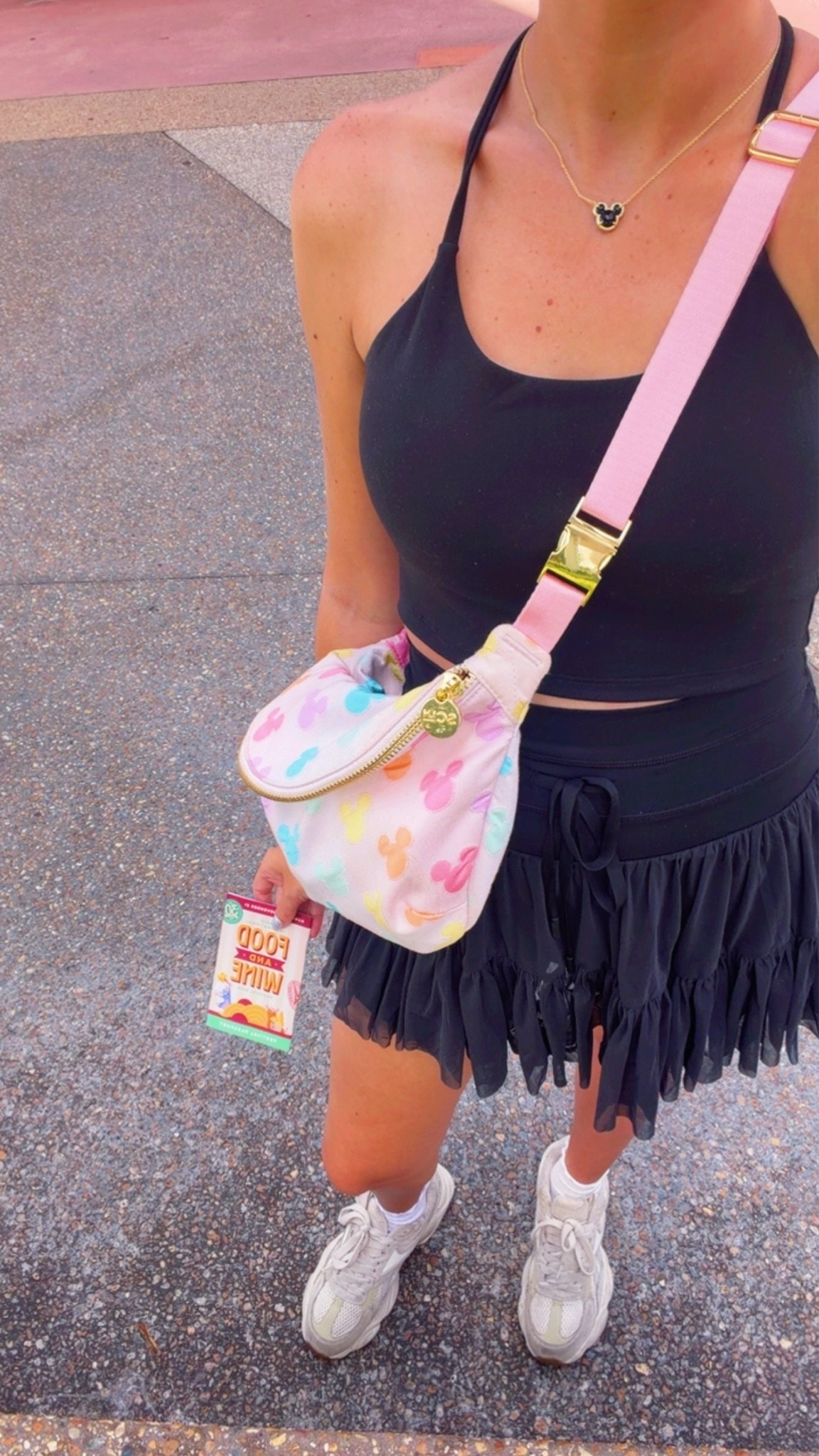 EPCOT OOTD🤍 Epcot outfit, Disney outfit, Disney style, Disney parks, Disney inspo, Disney ideas, Disney bound, comfy outfits, two piece black matching set, Popflex pirouette skort and crop top, jumbo Stoney clover fanny pack, Disney bag, Minnie Mouse polka dot ears, Amazon sunglasses, Disney jewelry, Disney accessories, chunky Reebok sneakers, Disney socks #disney
