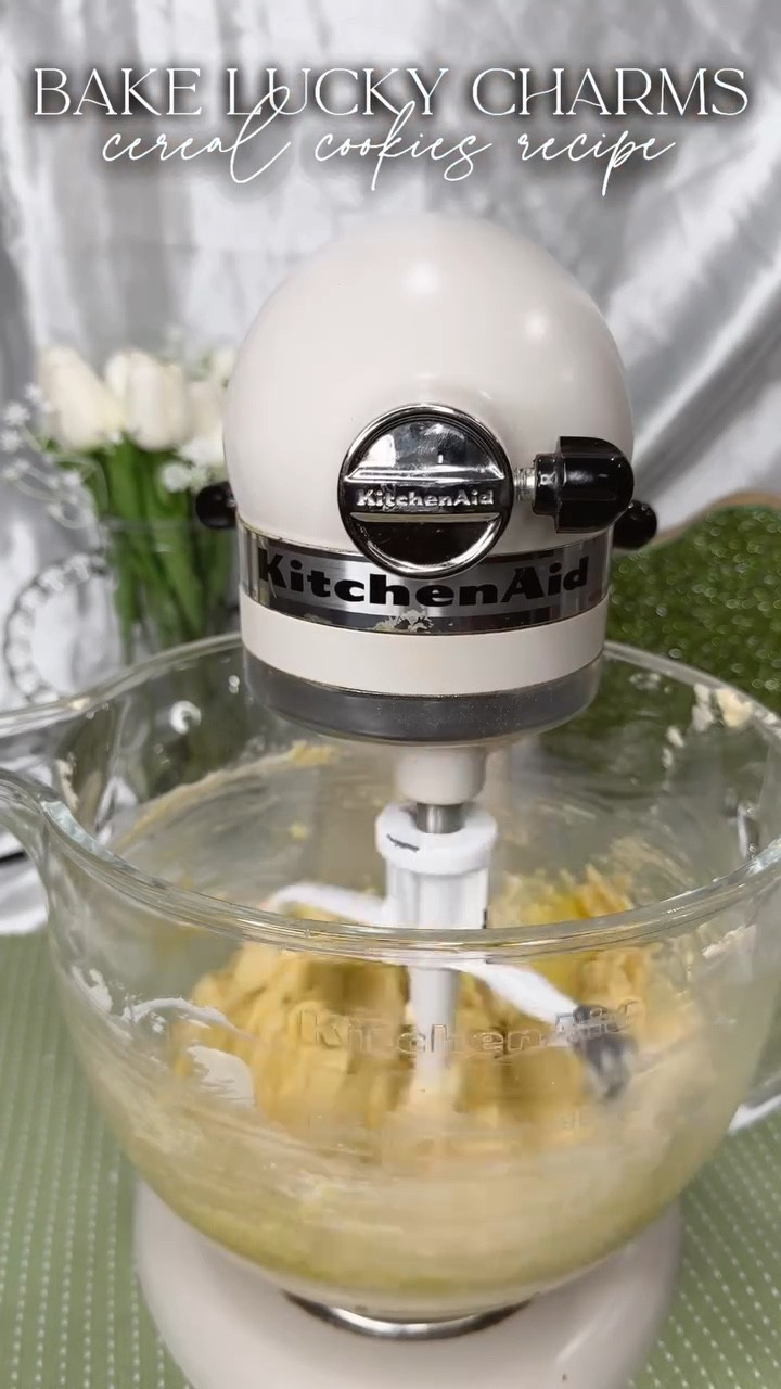 Turning my favorite childhood cereal into an indulgent cookie🌈
.
Recipe at the end of the video. 🍀
.
Ingredients:
*  1 cup of unsalted butter, room temperature
*  1 cup of packed brown sugar
*  1/4 cup of granulated sugar
*  2 large eggs
*  1 tablespoon of vanilla extract
*  3¼ cup of all-purpose flour
*  1 teaspoon of cornstarch
*  1 teaspoon of baking soda
*  1 teaspoon of salt
*  1 cup of Lucky Charms cereal, marshmallows too
*  2 cups of white chocolate chips
*  1/2 cup reserved Lucky Charms marshmallows
Instructions:
1.  Preheat the oven to 410°F. Line two cookie sheets with parchment paper or grease them with cooking spray.�Set aside.
2.  In the bowl of a stand mixer fitted with the paddle attachment, beat the butter for about 3 minutes.
3.  Add the brown sugar and granulated sugar, and mix until well incorporated, light, and fluffy-about 3 minutes.
4.  Beat the vanilla extract and eggs into the butter mixture until well incorporated.
5.  Add in the flour, baking soda, cornstarch, and salt, and mix until well incorporated.
6.  Lastly, add the white chocolate chips and Lucky Charms cereal and mix on low until well incorporated.
7.  Using a cookie scoop or large tablespoon, form the dough into balls of about the size of a tennis ball. Roll each ball in your hand to form a sphere shape.
8.  Place each completed cookie dough ball on the baking sheet, about four inches between each. About six per tray.
9.  Bake for 10-11 minutes or until just golden brown.
10.  Remove from the oven and immediately press into the warm cookies the reserved marshmallows.
11.  Cool fully on the cookie tray. The cookies will be slightly underdone but will finish baking while cooling off.
12.  Enjoy!
.
#luckycharmcookies #cerealcookies #recipe #baking #stpatricksday