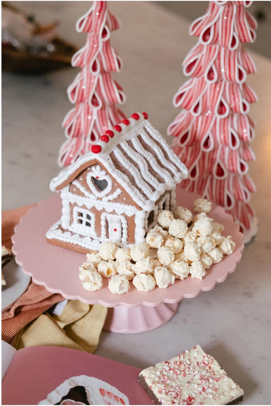 This Gingerbread House set up is so cute! I love the ribbon candy trees! This company didn’t have a pink cake stand, so I linked a white one and then a really pretty pink one from Walmart...that’s the one I’d choose ;)
🤍
Christmas Decor, Pink Christmas Decor, Gingerbread house, Christmas Candy trees, Pink Christmas tree decorrations

#LTKSeasonal #LTKHoliday #LTKhome
