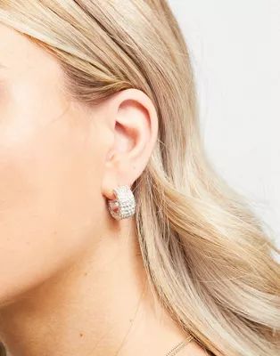 True Decadence rhinestone encrusted chunky huggy hoop earrings in silver | ASOS (Global)
