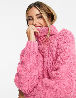 River Island – Strickpullover mit Tunika-Schnitt, Rollkragen und Zopfmuster in Rosa | ASOS (Global)