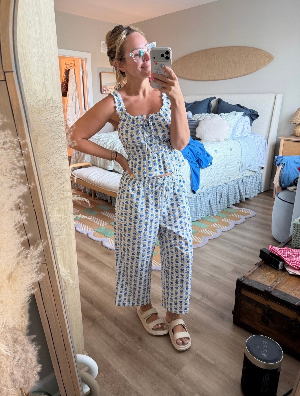 Blue-and-white pajamas that are cute enough to answer the door in and comfortable enough to wear all weekend. ☁️💙

The smocked tank + relaxed pants combo feels so much more elevated than my old oversized tee and sleep shorts situation. Lightweight, breathable, and giving major coastal summer mornings energy.

Linked in LTK! ✨ #LTKStyleTip #LTKHome #PajamaSet #SummerStyle #CoastalStyle #ComfyChic #MatchingSet #PetiteStyle
