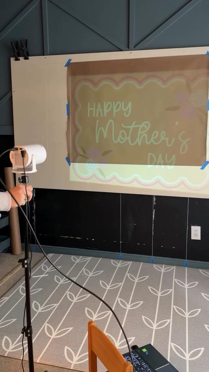 But why does this always have to be such a process 🤣 IYKYK.

This projector and I go through the same little dance every single banner. One minute I think I finally have it lined up perfectly, the next I’m moving it around again and squinting at the wall like it’s going to magically fix itself 😂

And yes, I’ve tried projecting first and then lining up the paper to the projection, but somehow that process is even more chaotic for me. So for now this is the routine. Adjust it, step back, squint, adjust it again, and eventually act like it all came together effortlessly 🤷🏼‍♀️

#banner #bannerartist #bannerpainting #bannerdesign #magcubicprojector