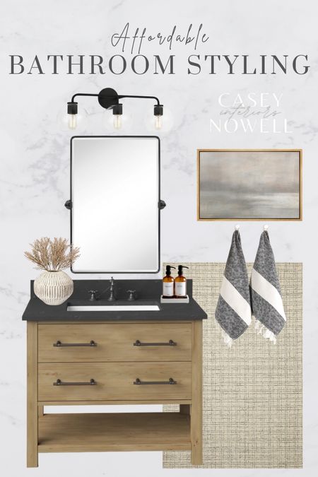 Bathroom styling, bathroom vanity, modern, neutral, vanity mirror, pivot mirror, vanity light, black lighting, rug, Turkish towels, hand towels, vase, dried floral, fall stems, amber glass soap dispensers, wall art, art canvas, landscape art, home, home decor. 

#LTKunder100 #LTKSeasonal #LTKhome