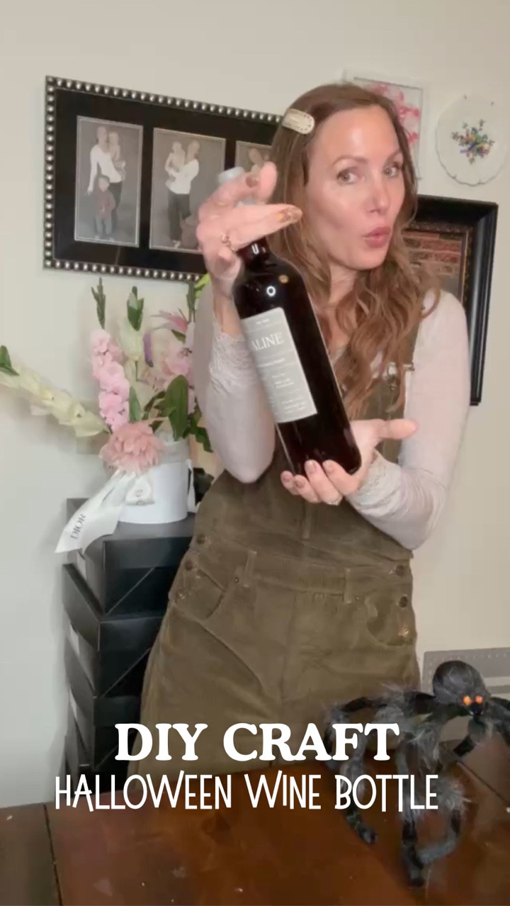 Linking my outfit and all the crafty supplies to make this cute Halloween themed wine bottle situation 🕷️