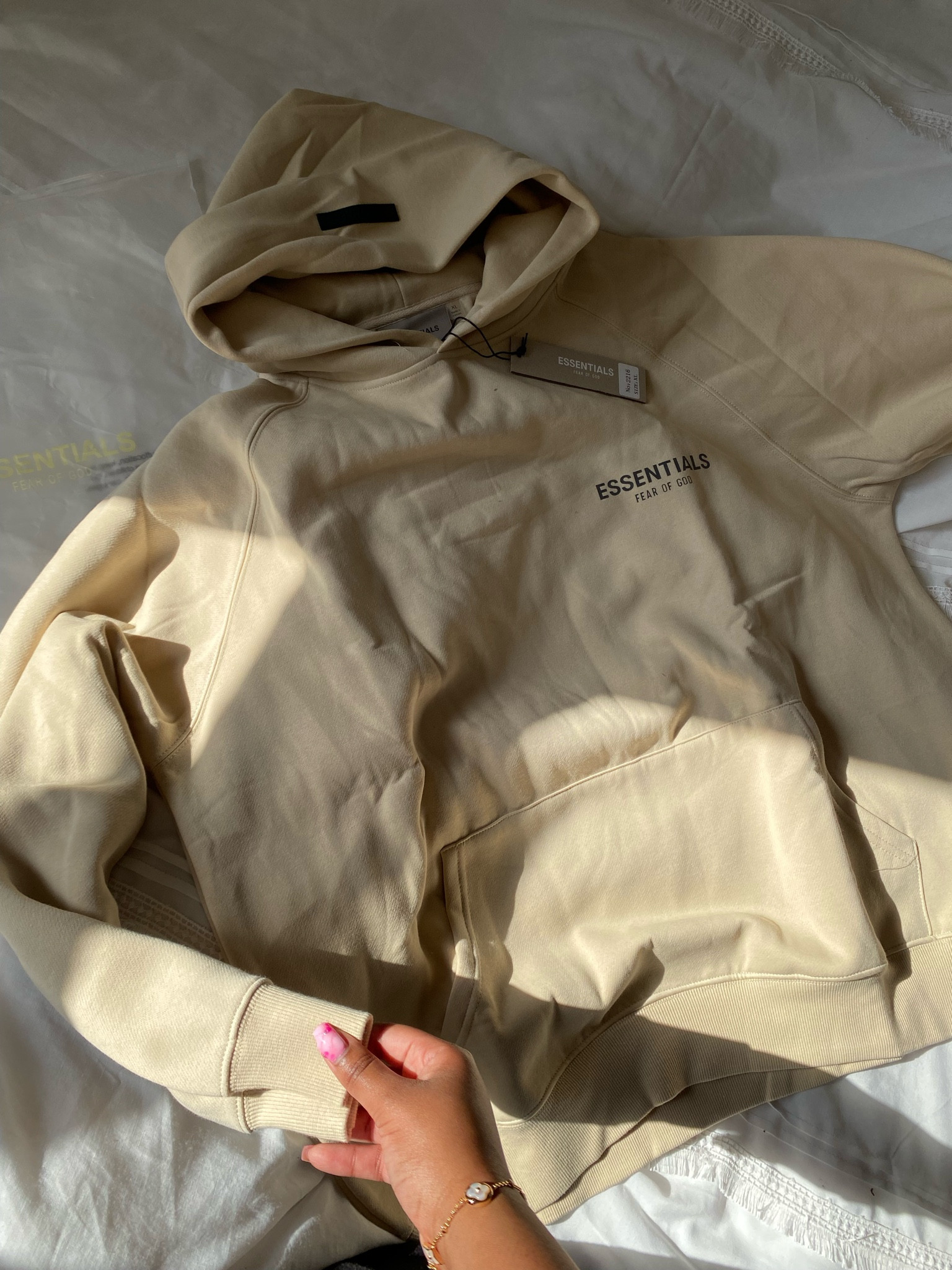 Fear of God Essentials Cream Pullover Hoodie With Reflective Text

#LTKstyletip #LTKFind #LTKSeasonal